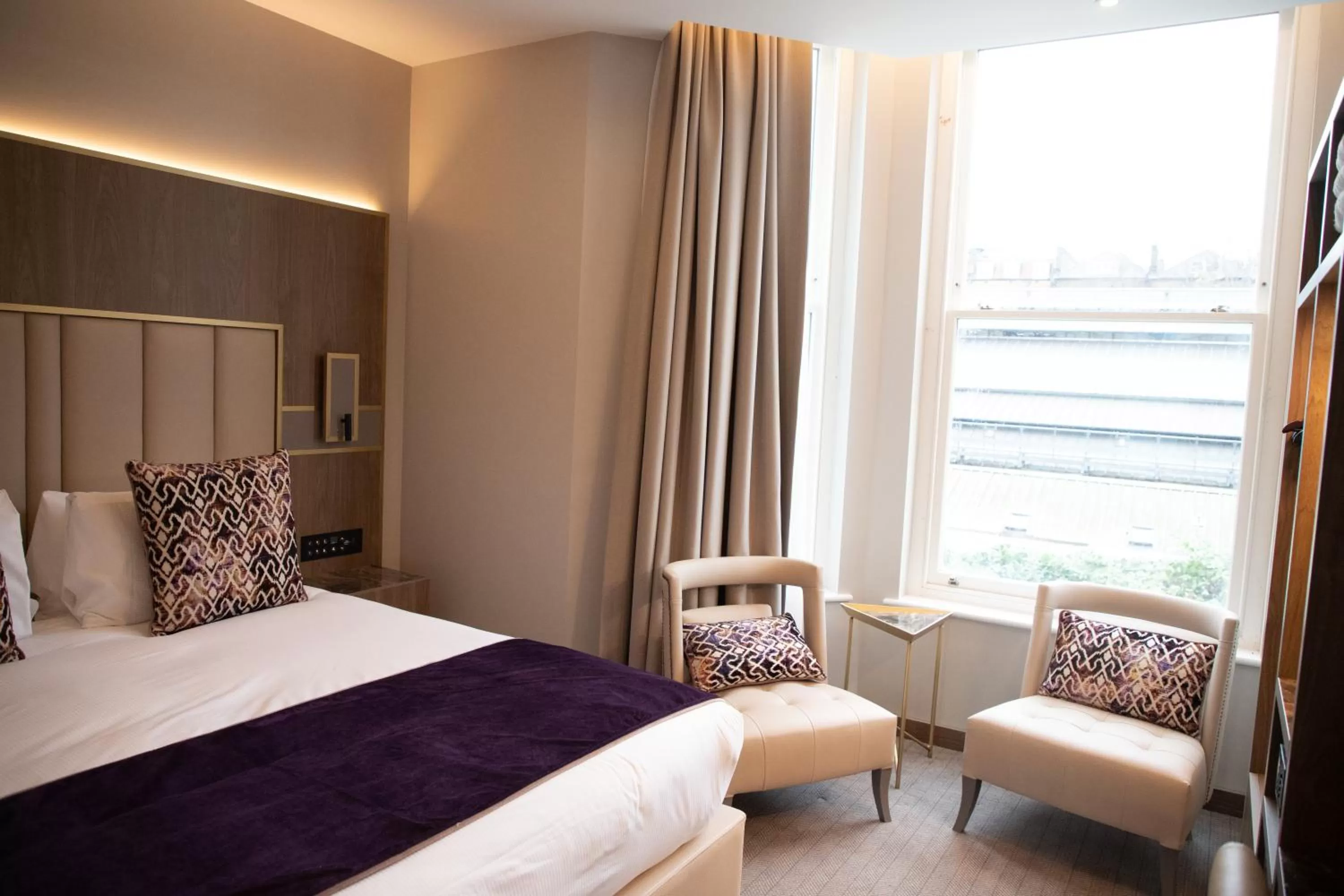 Bed in Merit Kensington Hotel