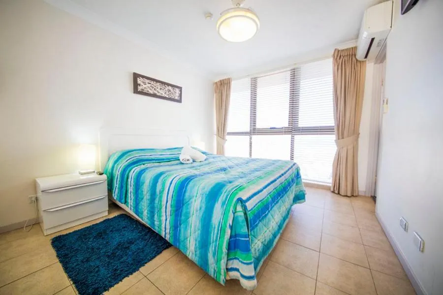 Bed in Warringa Surf Holiday Apartments