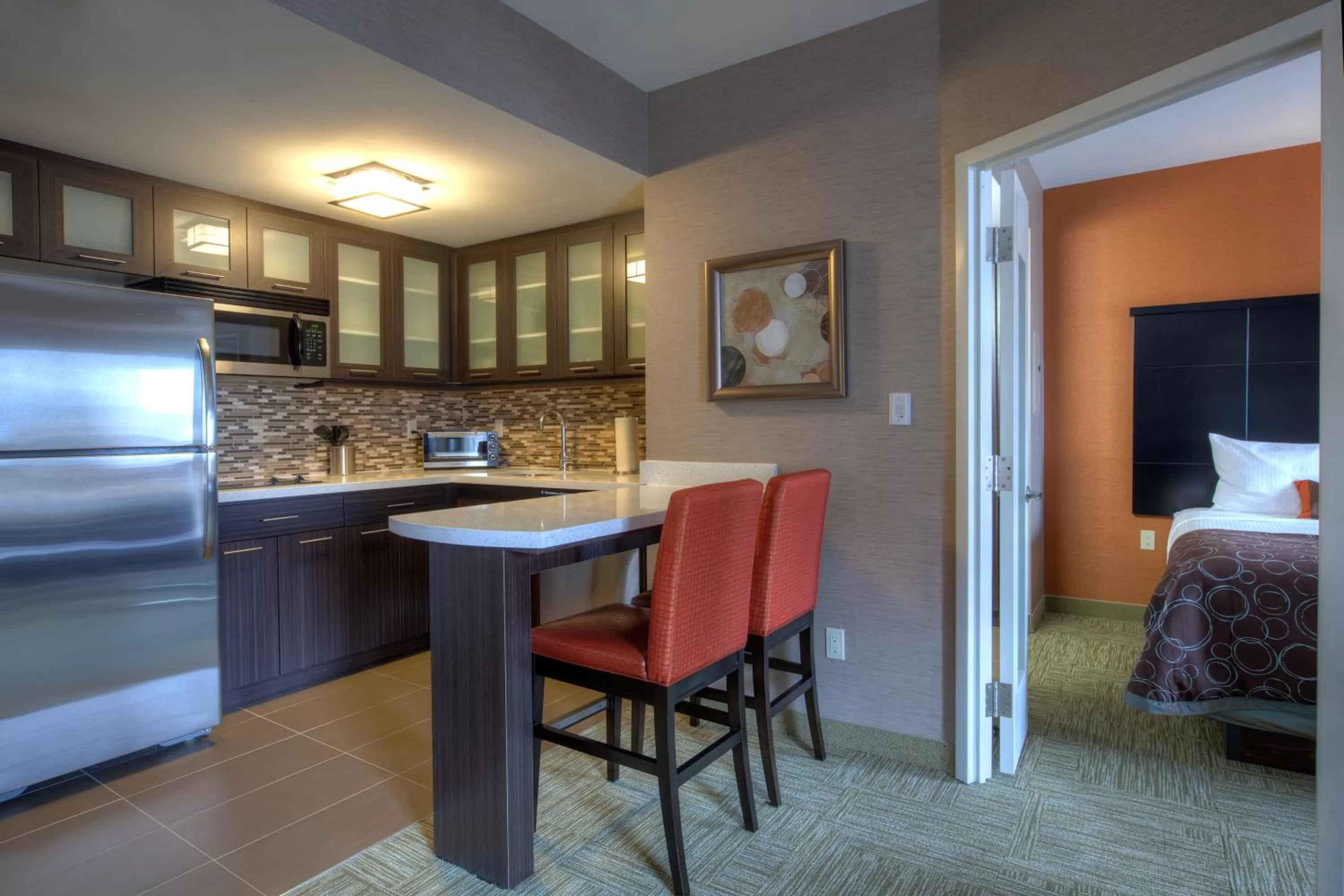 Kitchen or kitchenette, Bed in Staybridge Suites Hamilton - Downtown by IHG