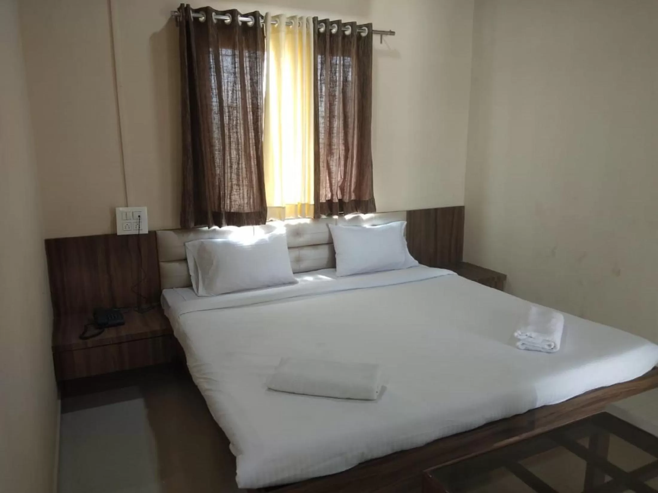 Bed in Hotel Krishna Exotica