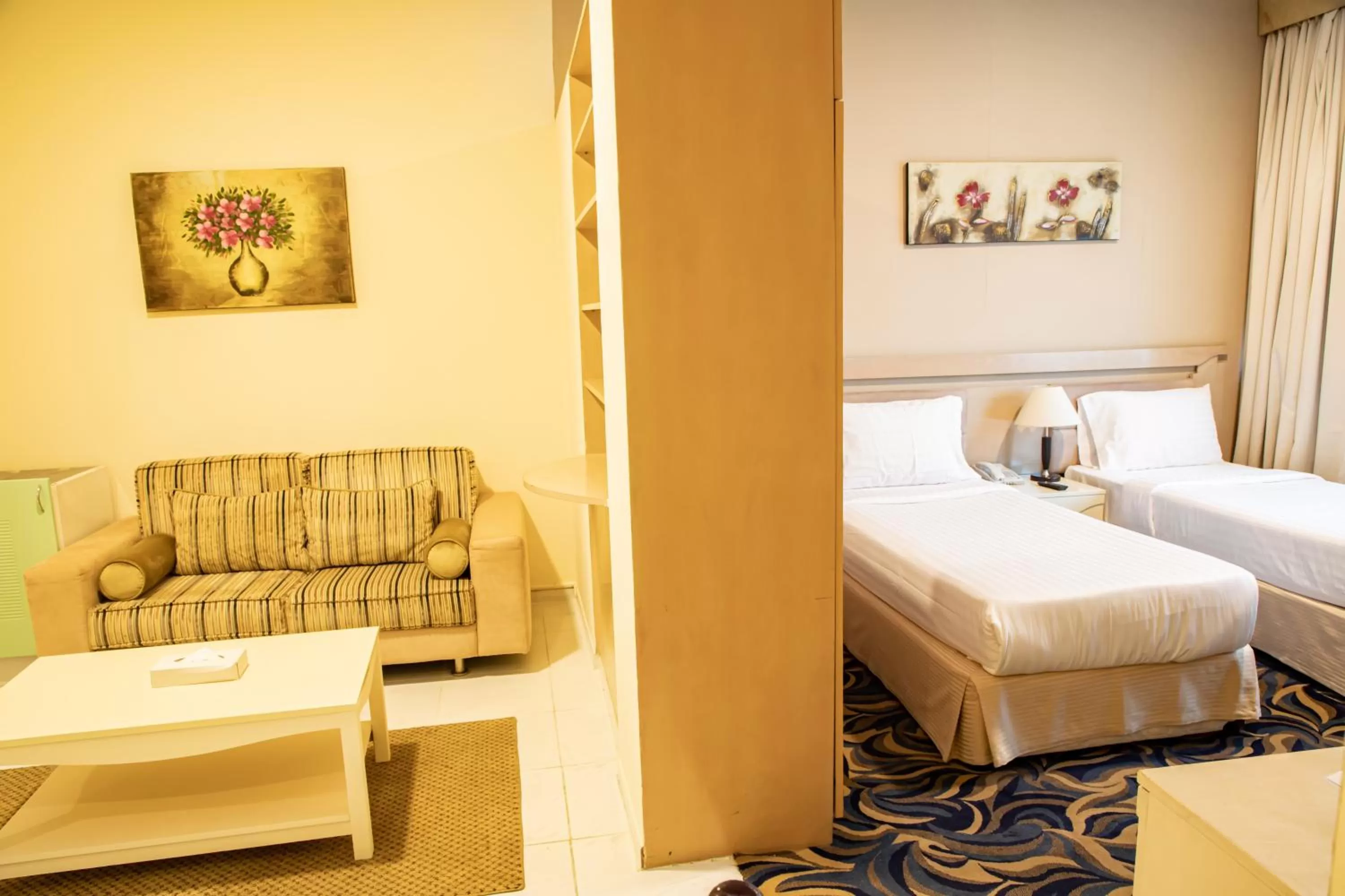 Seating area, Bed in West Zone Pearl Hotel Apartment