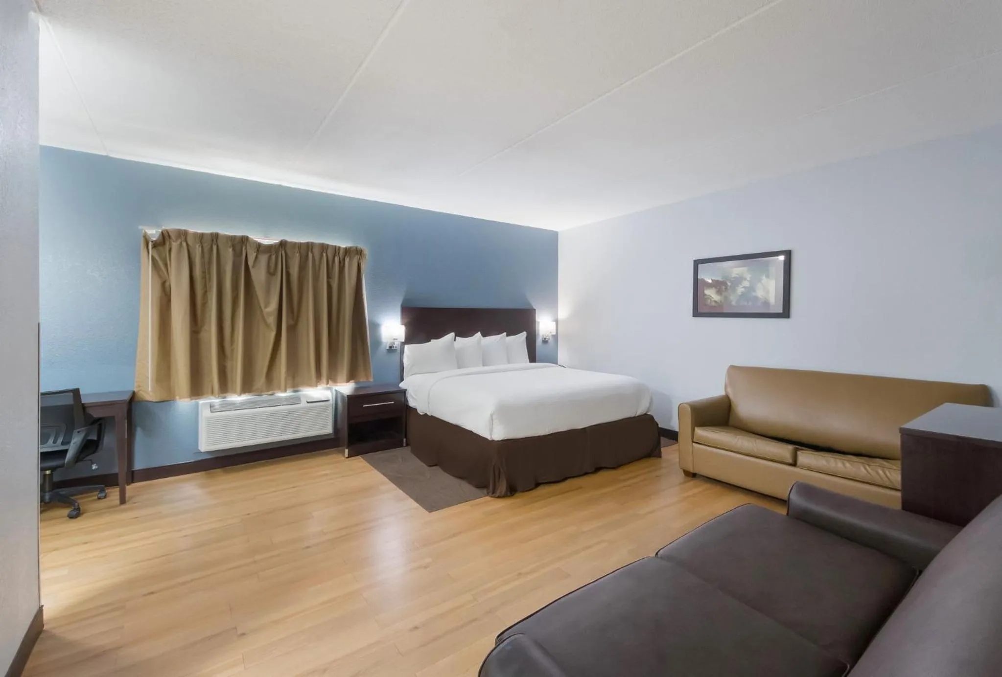 Bedroom, Bed in HomeTowne Studios by Red Roof San Antonio - SeaWorld Northwest