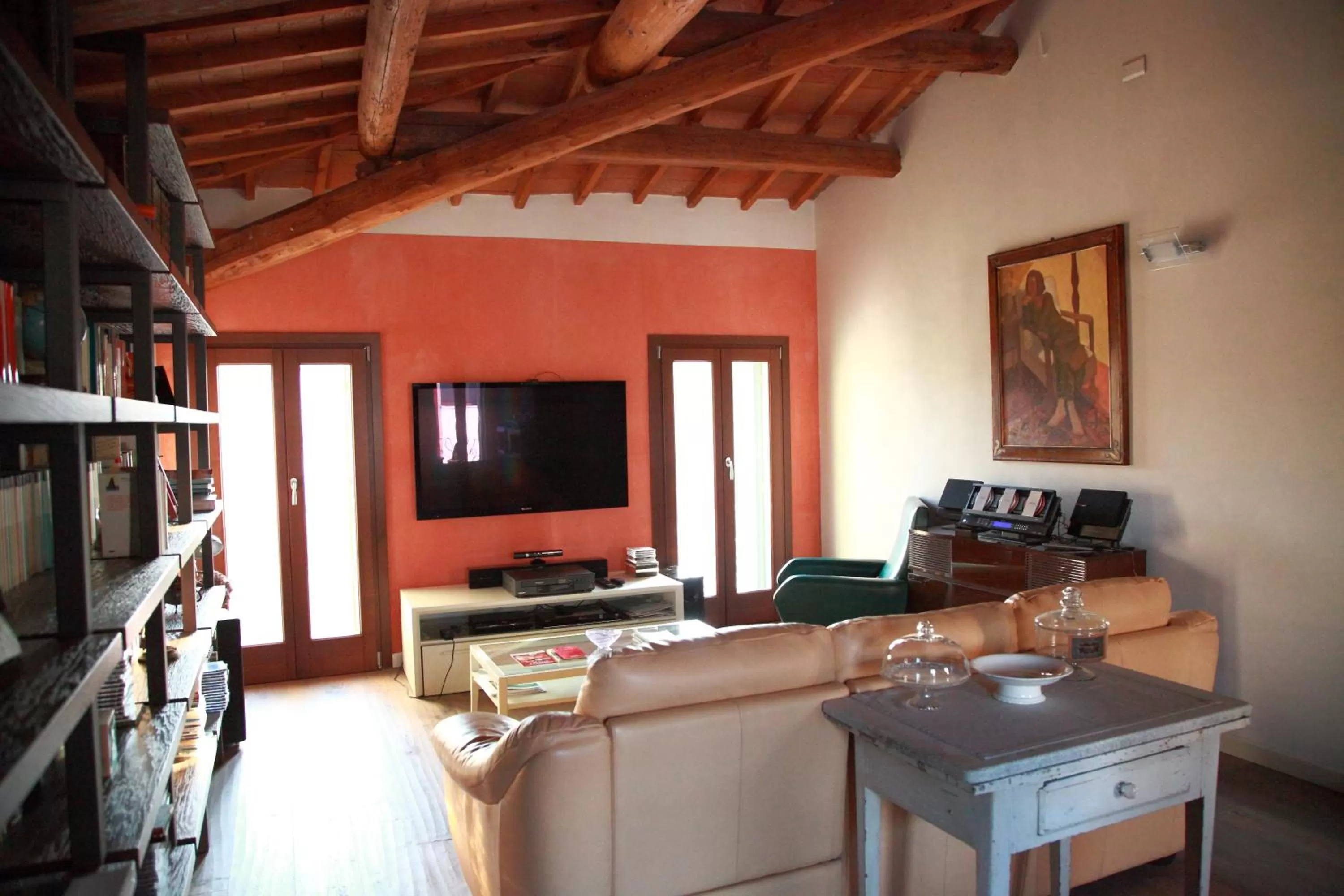 Communal lounge/ TV room in B&B La Magnolia