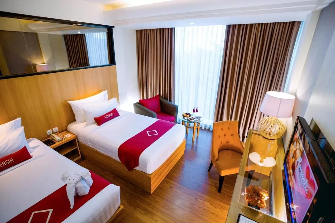 Bed in Emersia Hotel and Resort