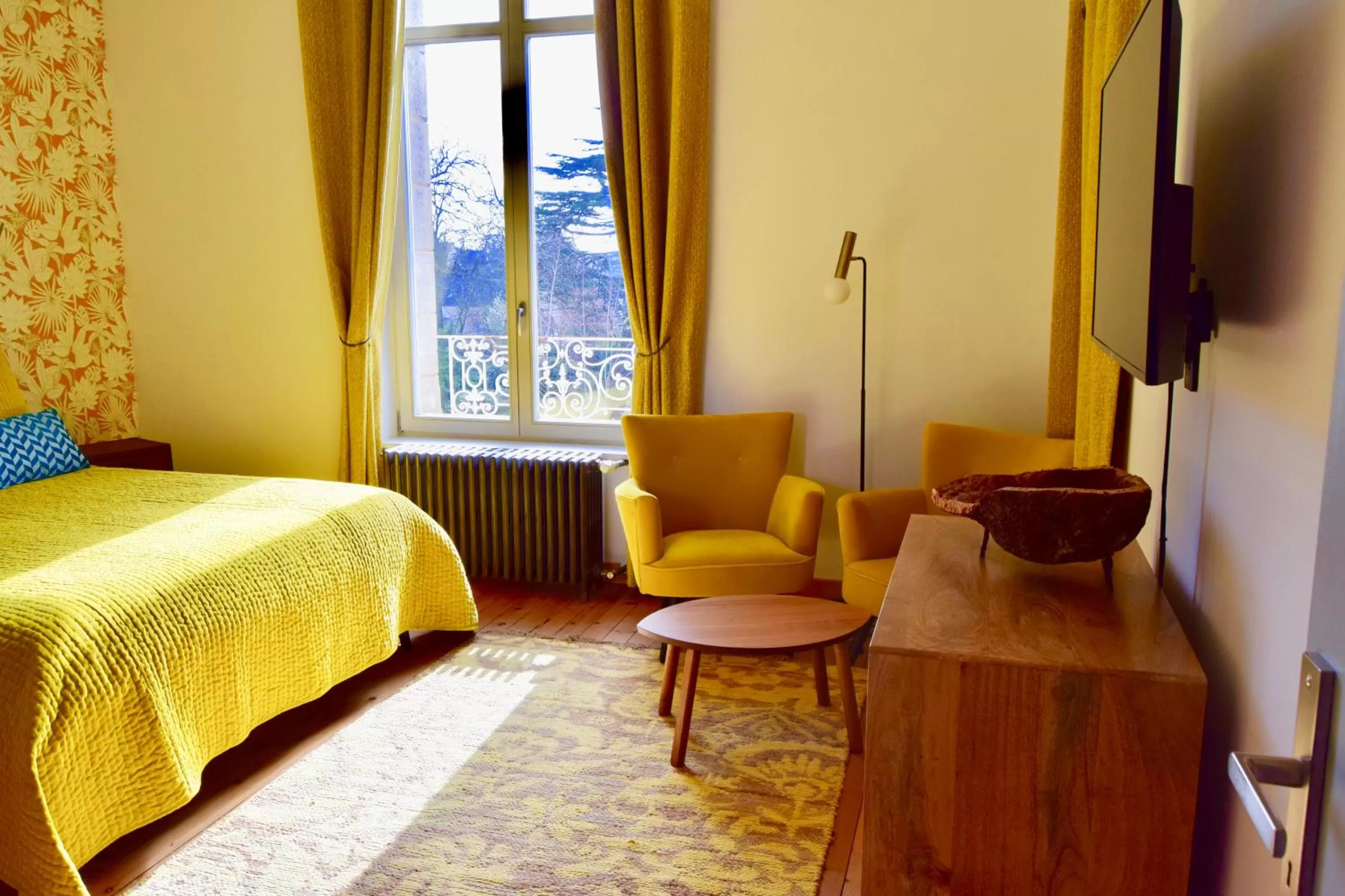 Seating area in Chambres d'Hôtes Le Clos des Marronniers