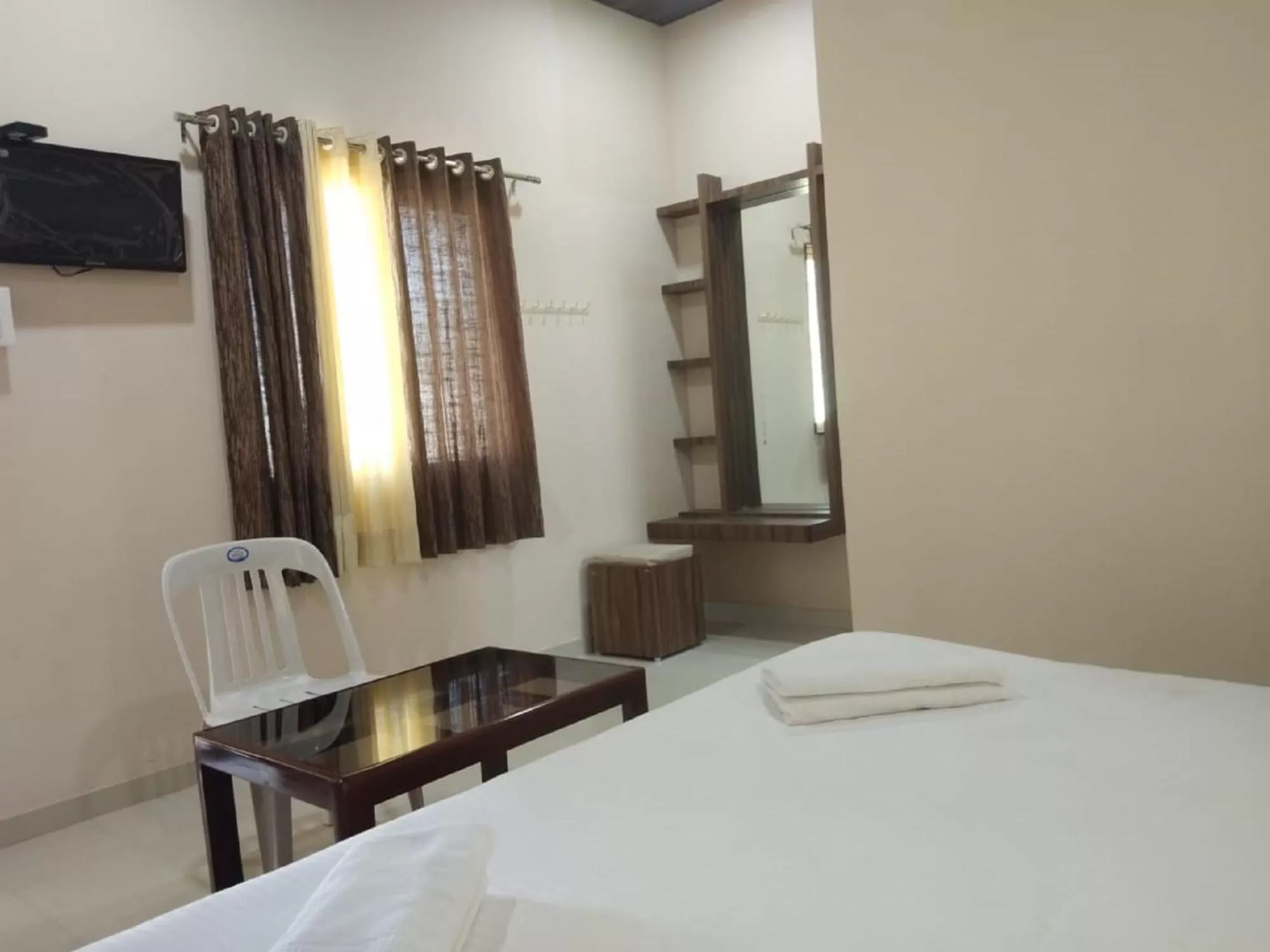 Bedroom, TV/Entertainment Center in Hotel Krishna Exotica