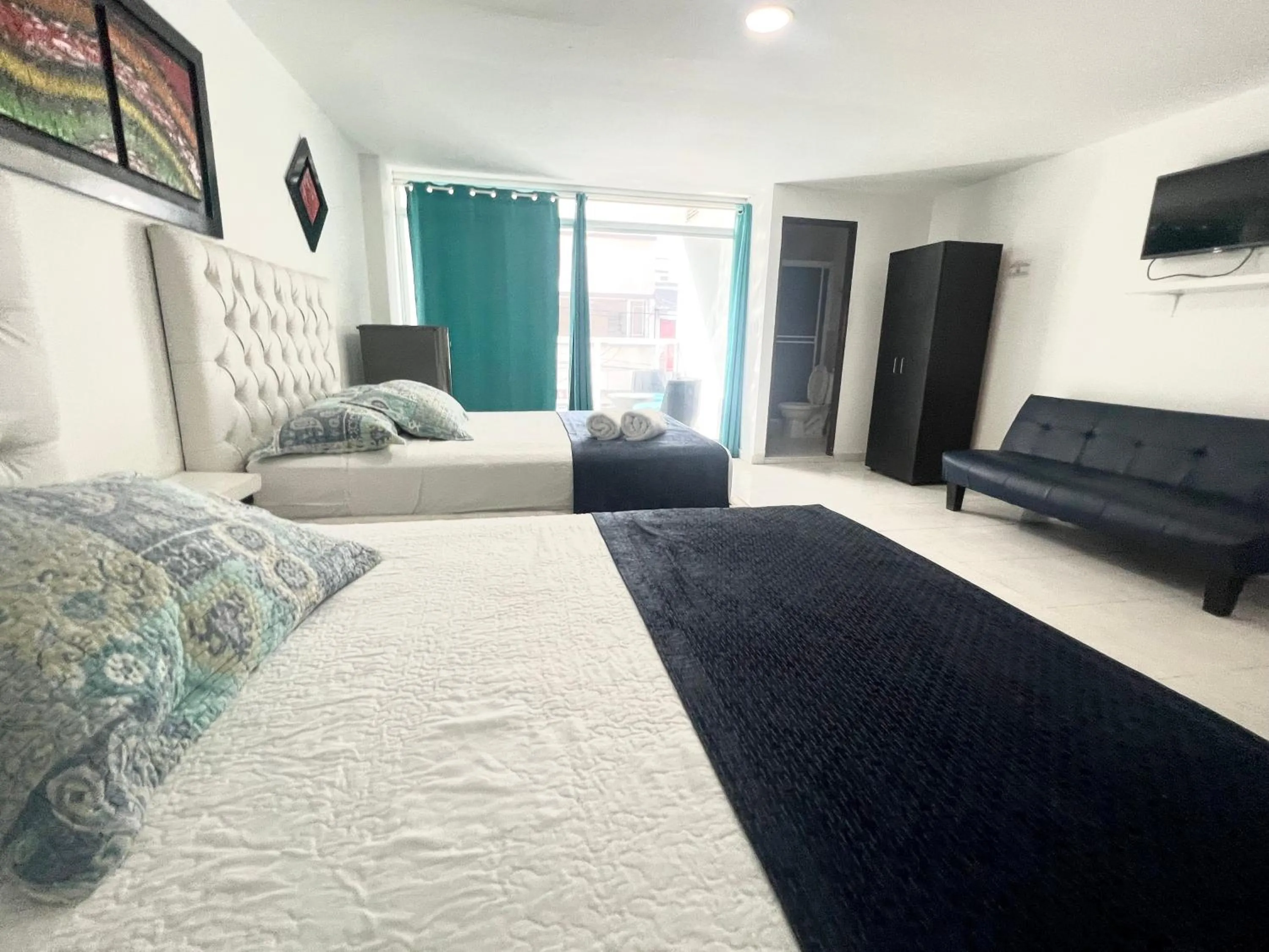 Photo of the whole room, Bed in Blue Emerald Inn