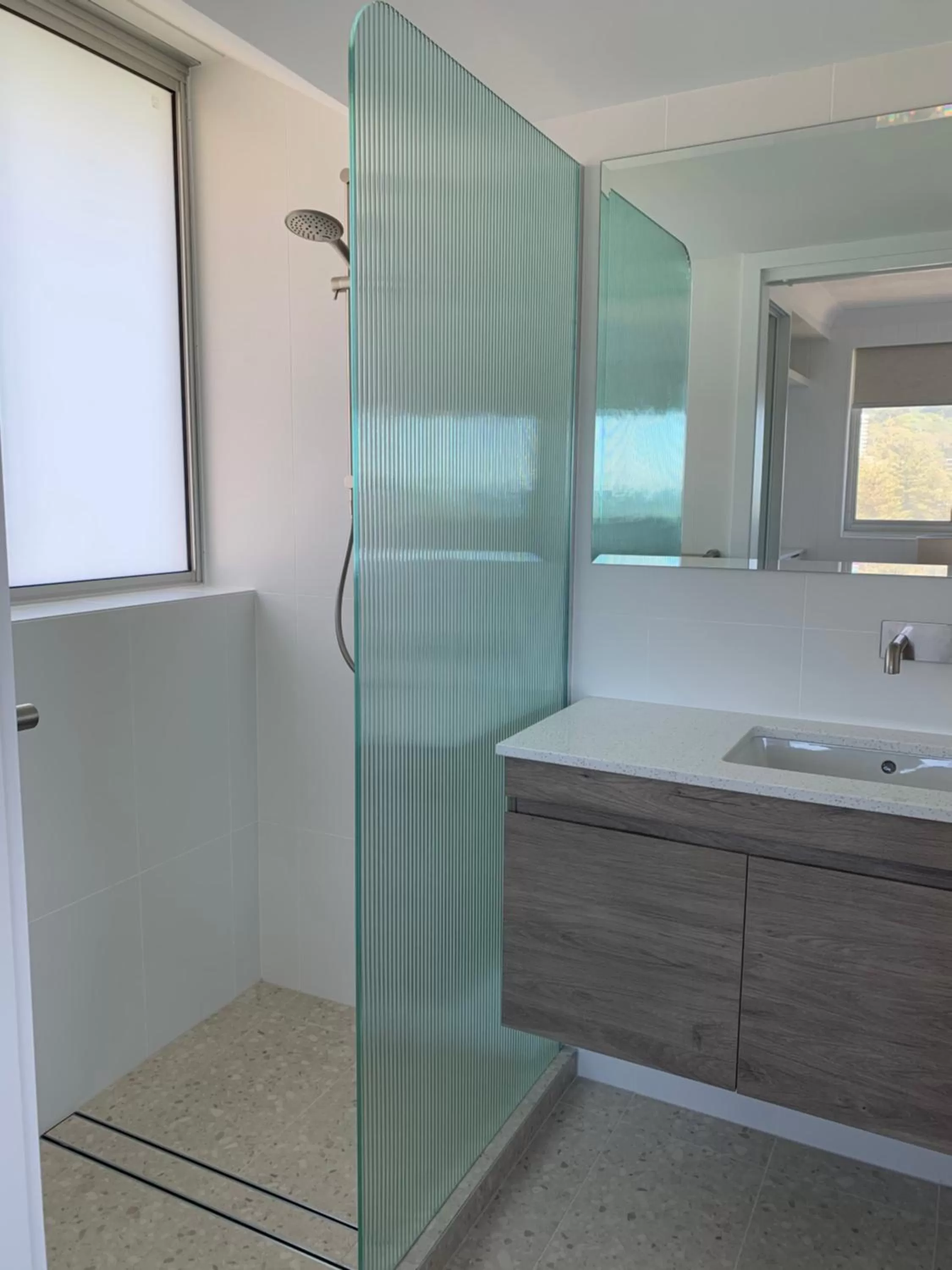 Bathroom in Pacific Regis Beachfront Holiday Apartments
