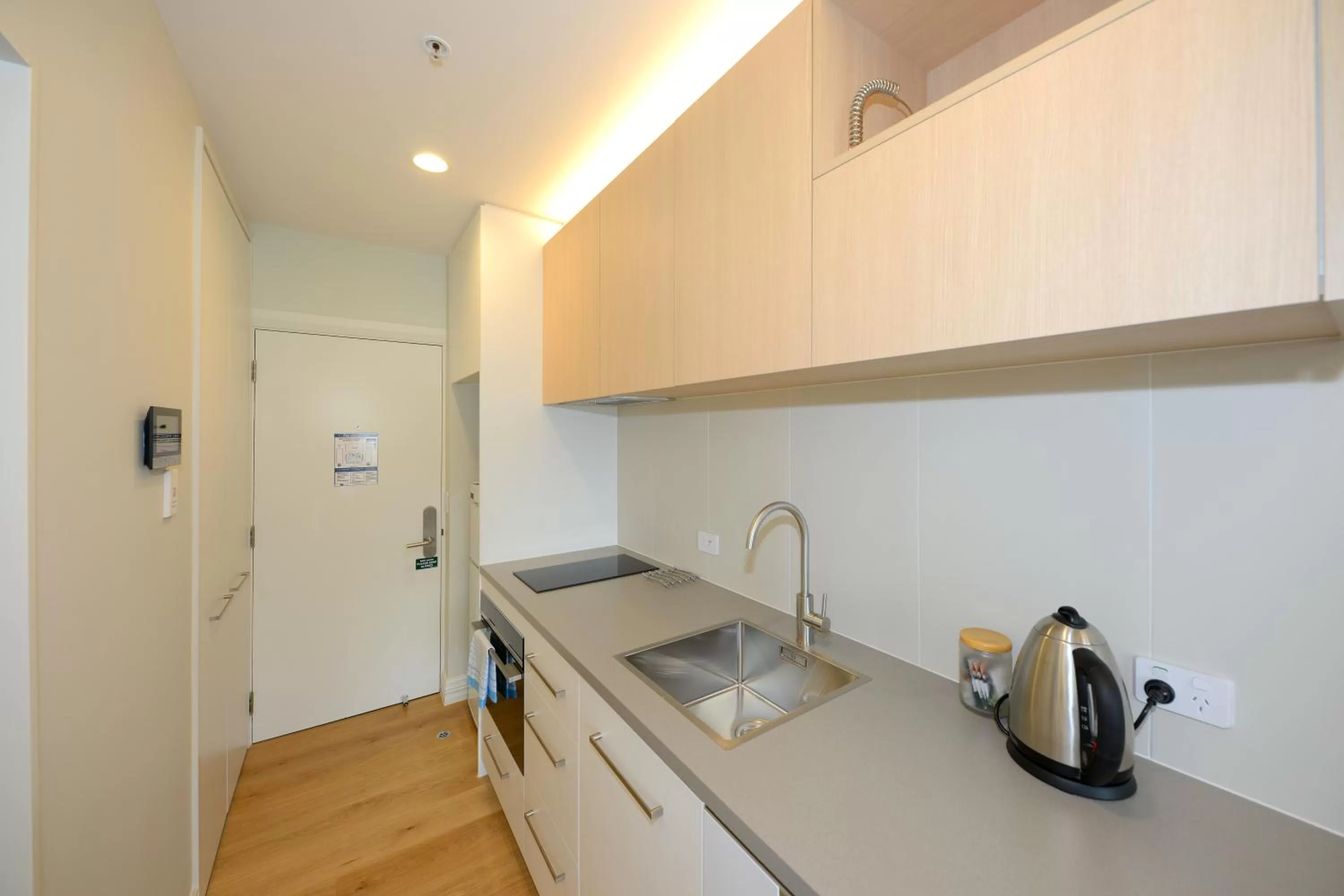 Kitchen or kitchenette in West Fitzroy Apartments