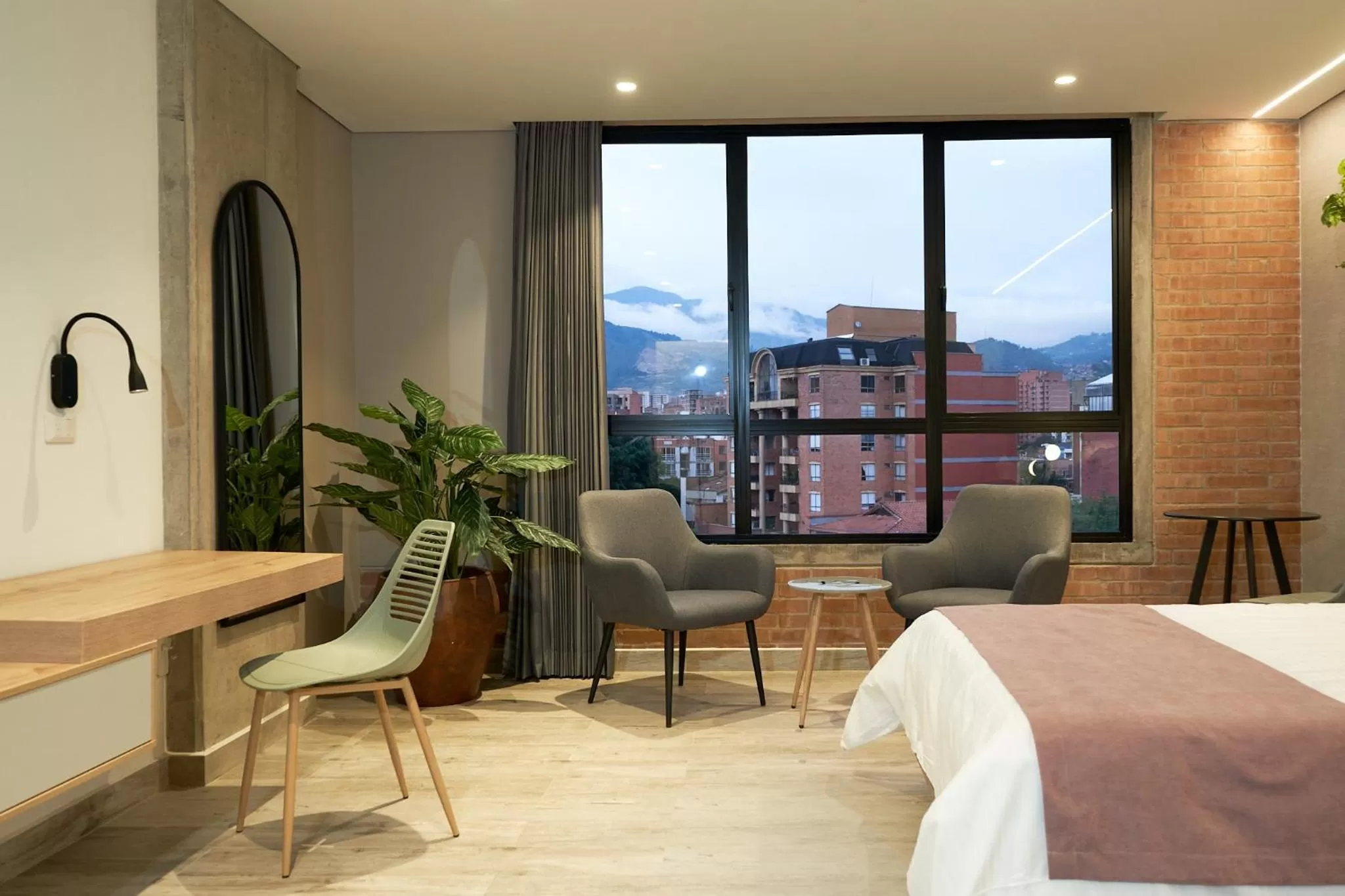 Seating area, Bed in Eutopiq Hotel