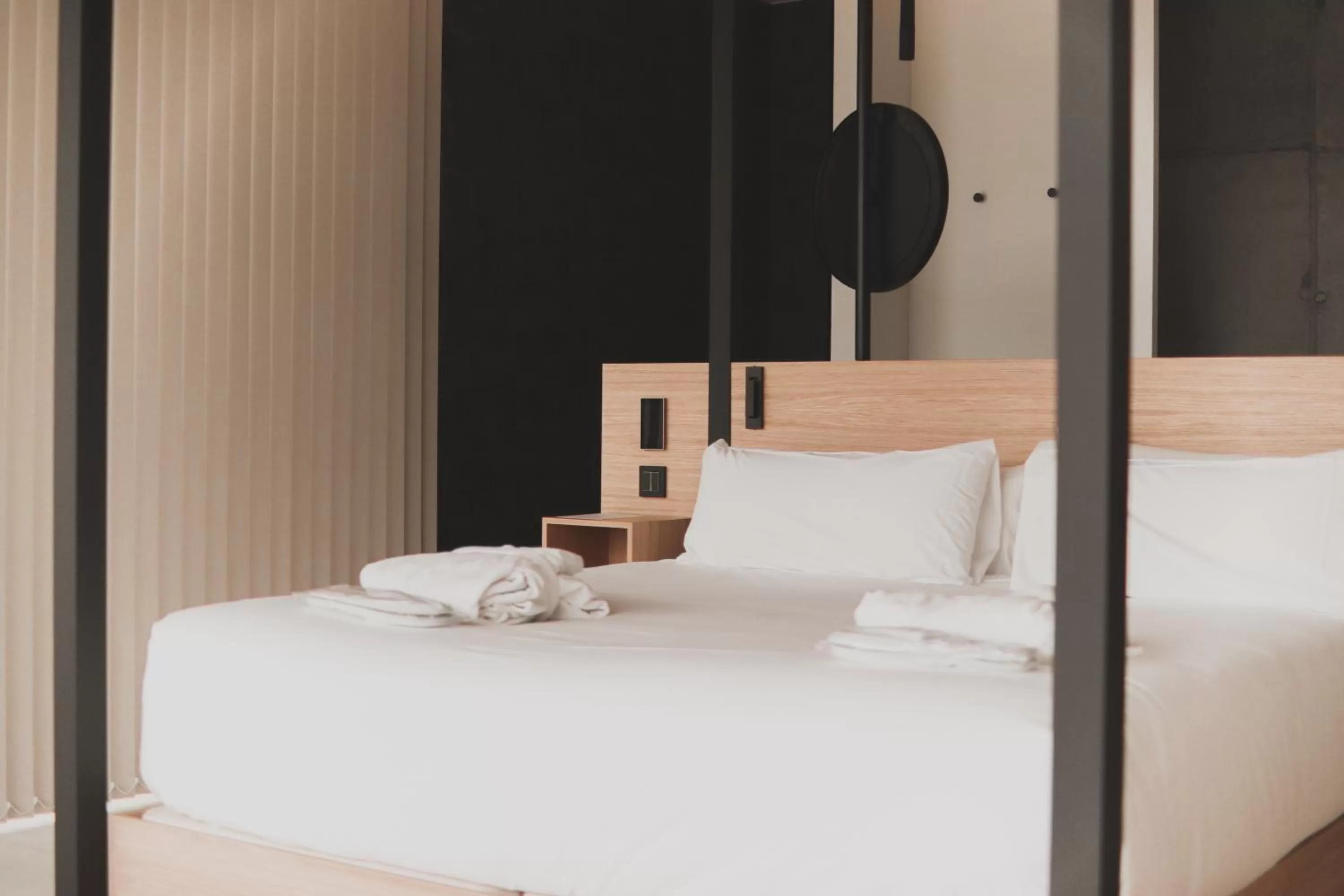 Bed in Atmos Hotel Boutique