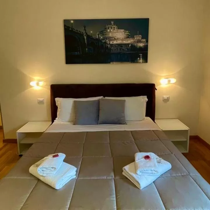 Bed in Rienzo Vatican Suites