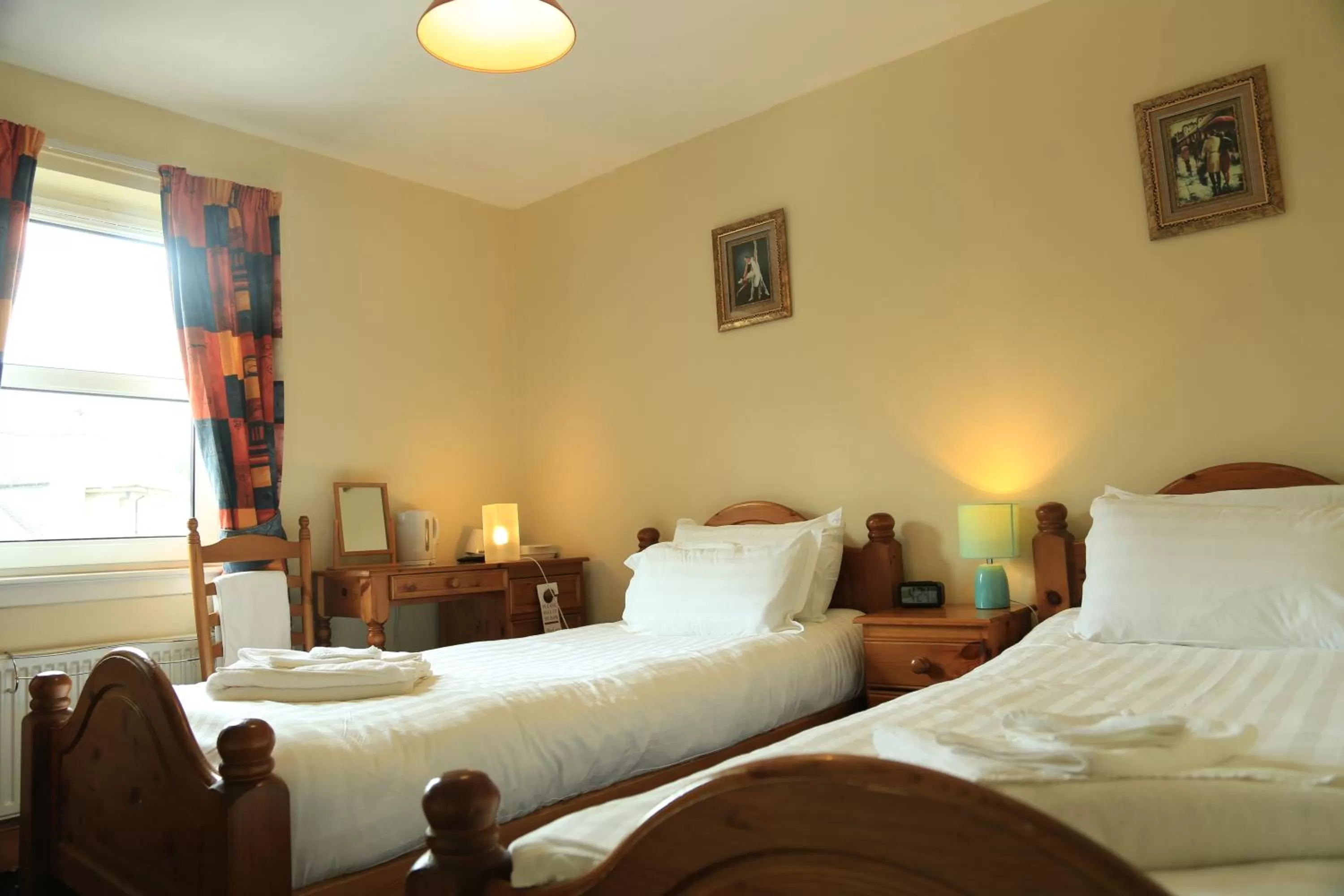 Bed in Twin Lions Hotel