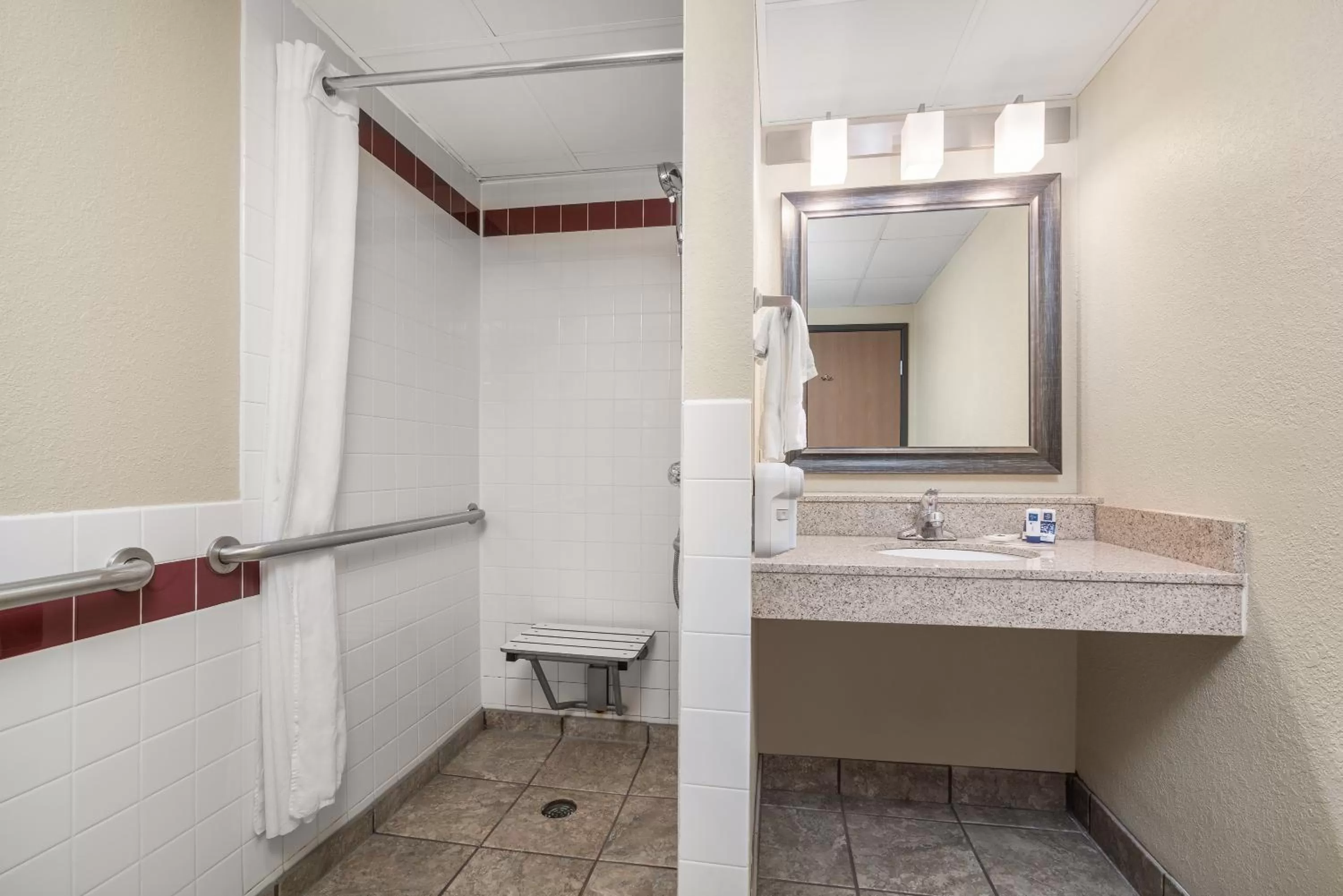 Bathroom in AmericInn by Wyndham Fargo West Acres