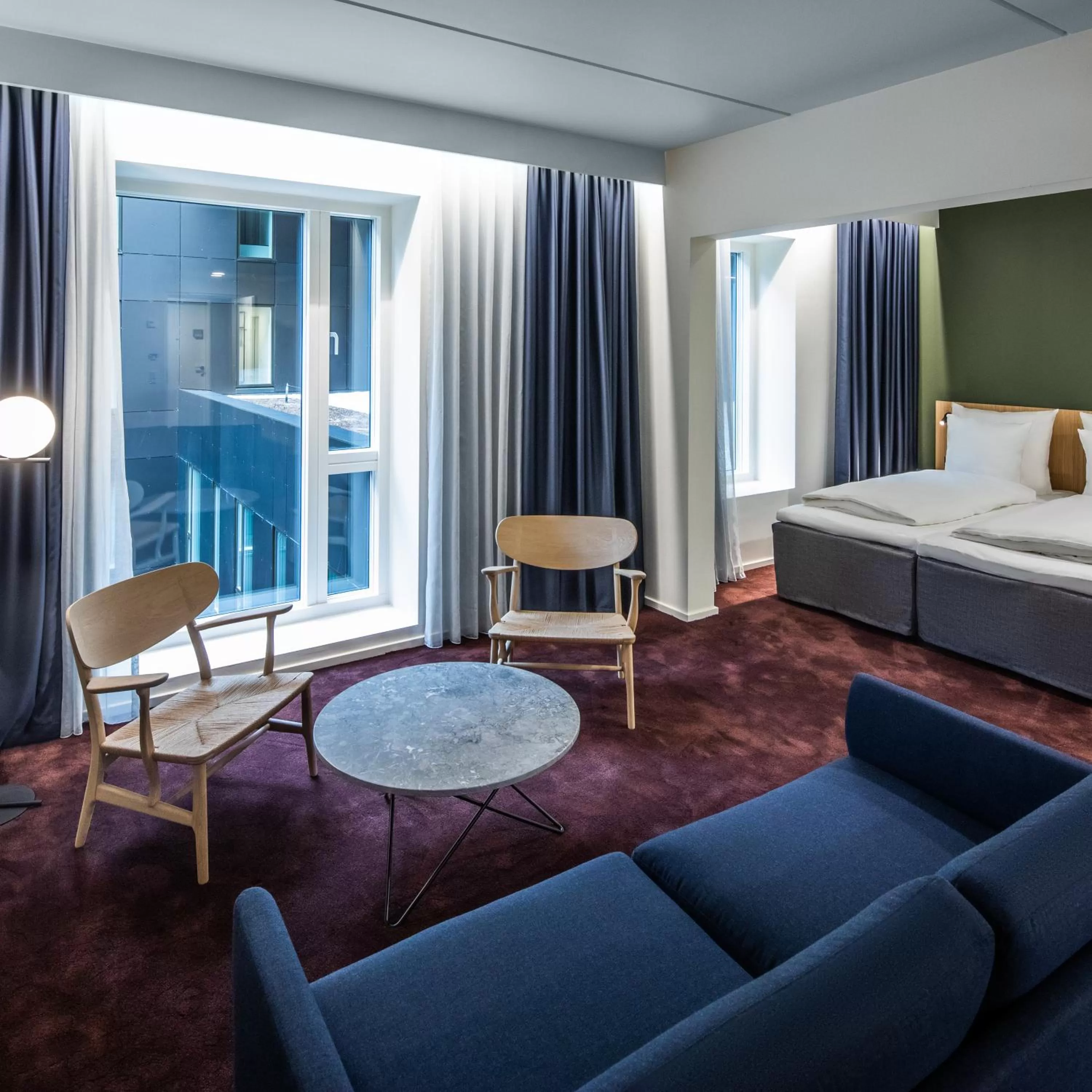 Seating area, Bed in Comwell Copenhagen Portside Dolce by Wyndham
