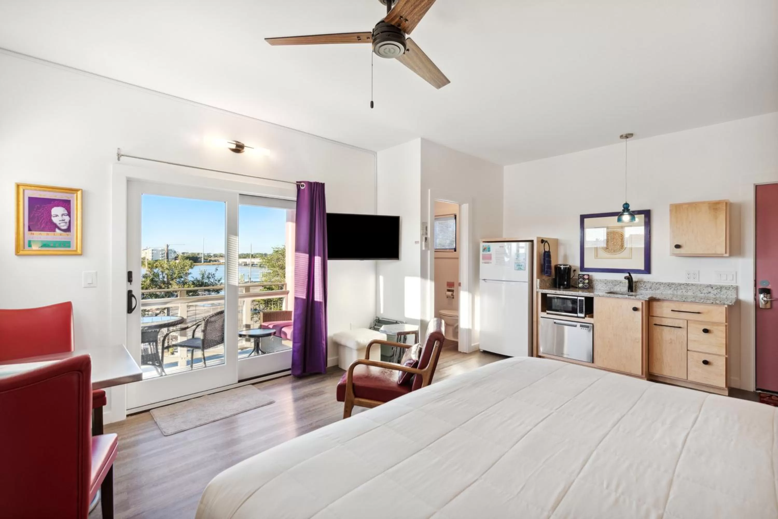 Bed in Hotel Folly with Marsh and Sunset Views