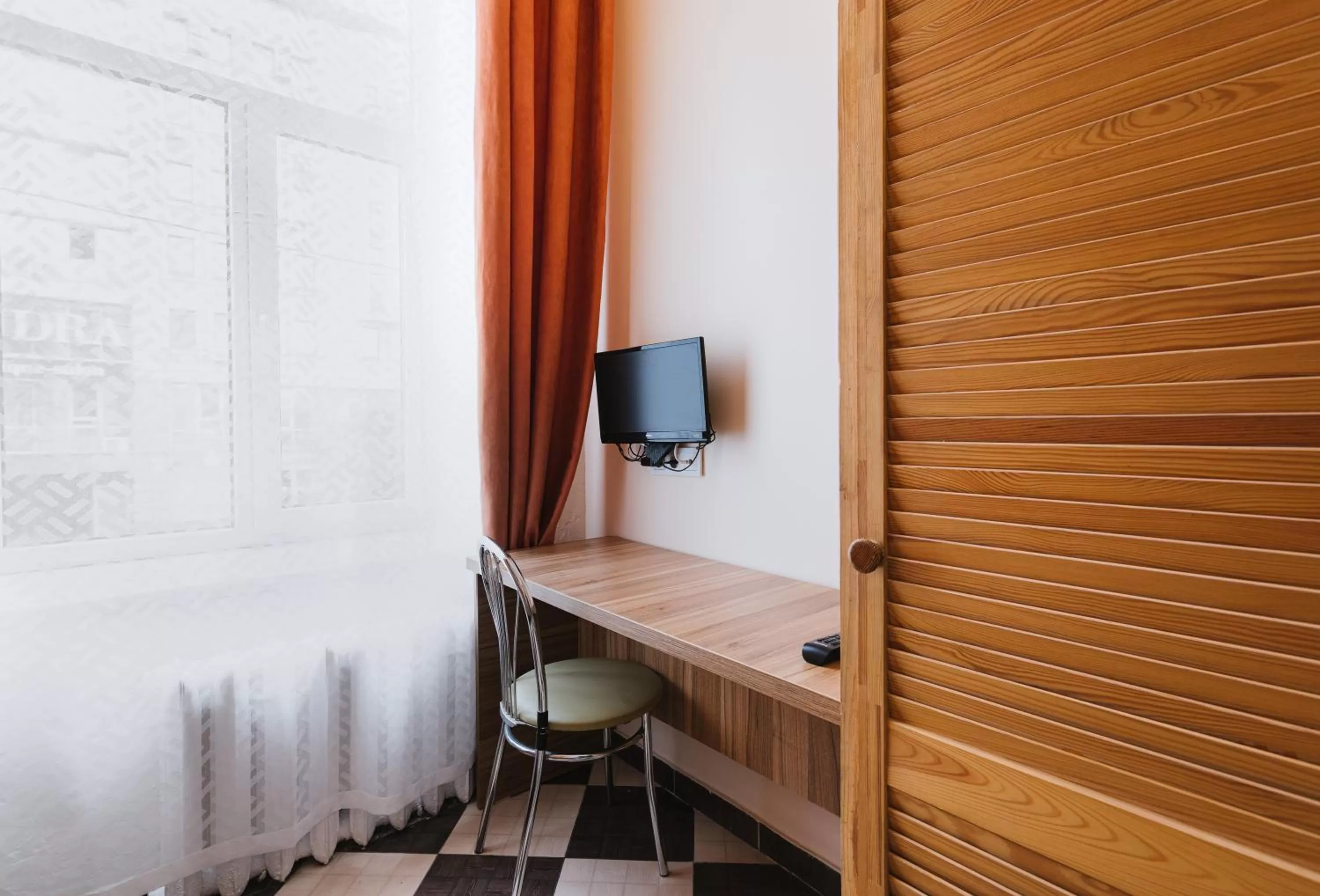 TV/Entertainment Center in Mini hotel Non-Stop