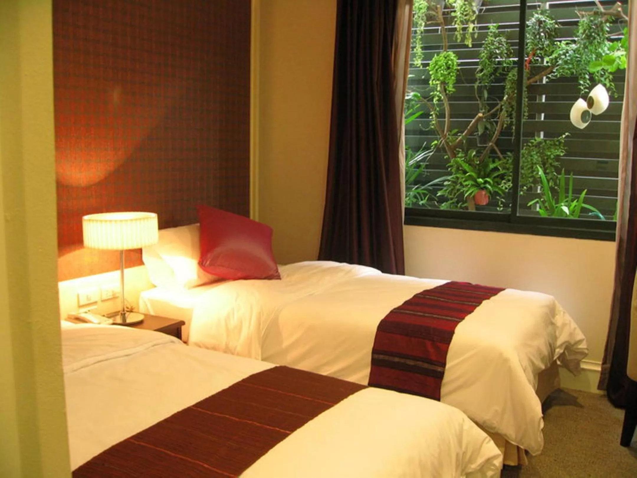 Bed in Aphrodite Inn Bangkok