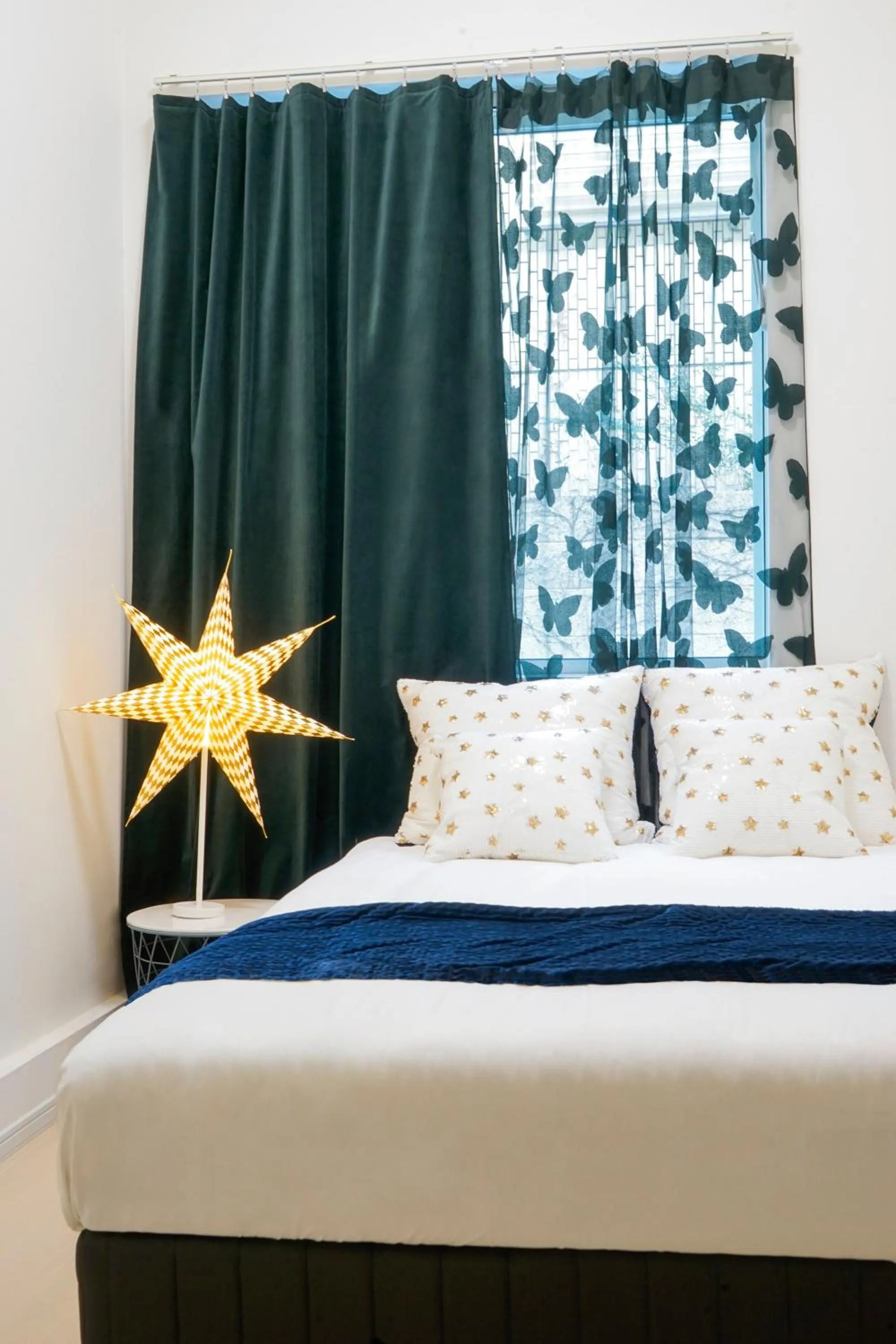 Bed in Blue Empire Hotel