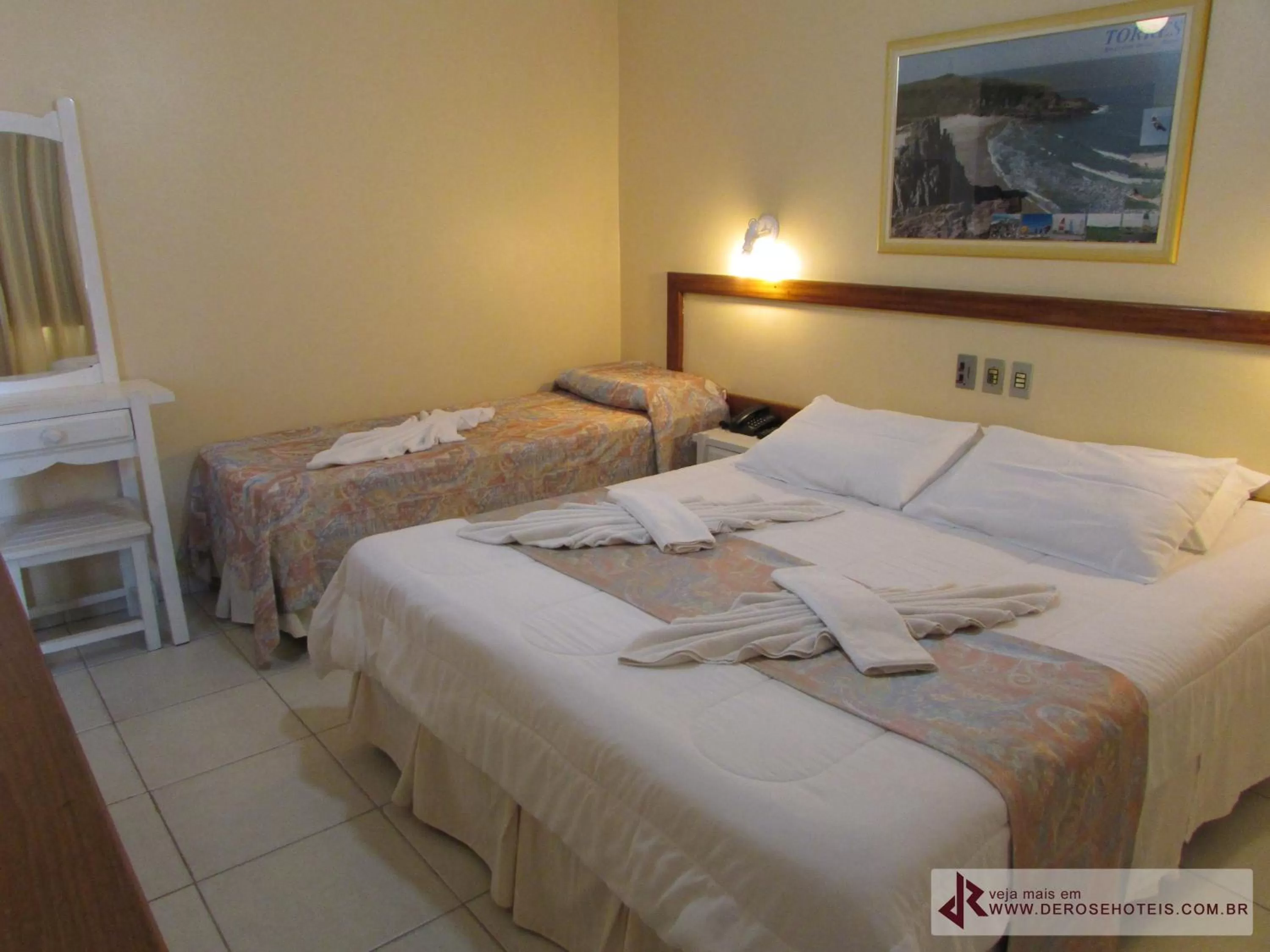 Bed in De Rose Palace Hotel