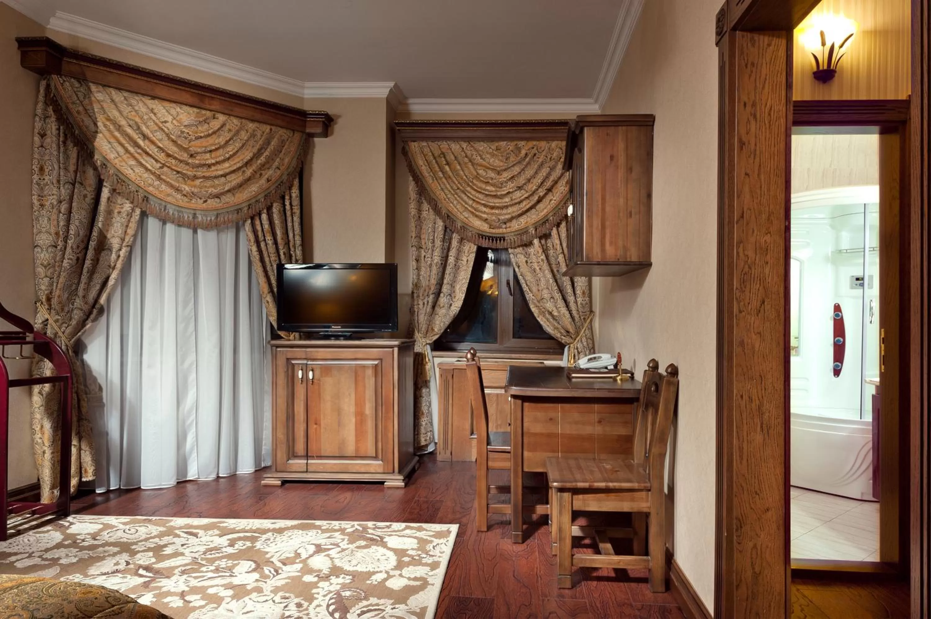 Living room, TV/Entertainment Center in Boutique Hotel Traditional