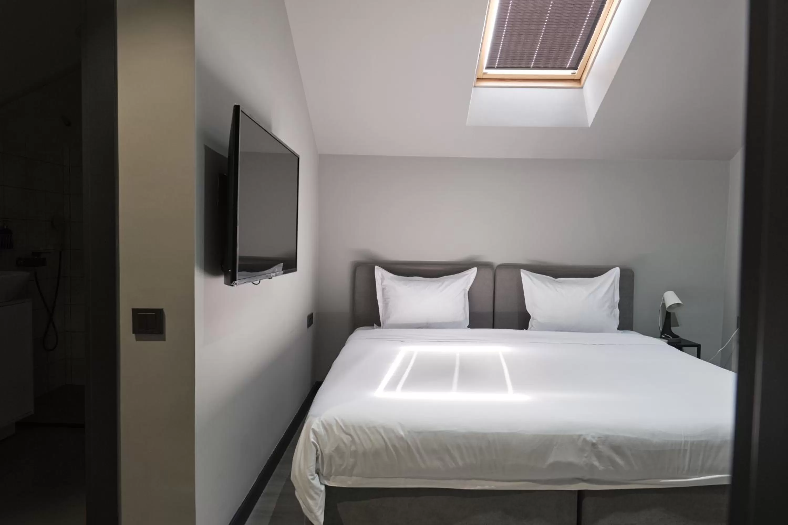 Bed in Sapiens Hotel