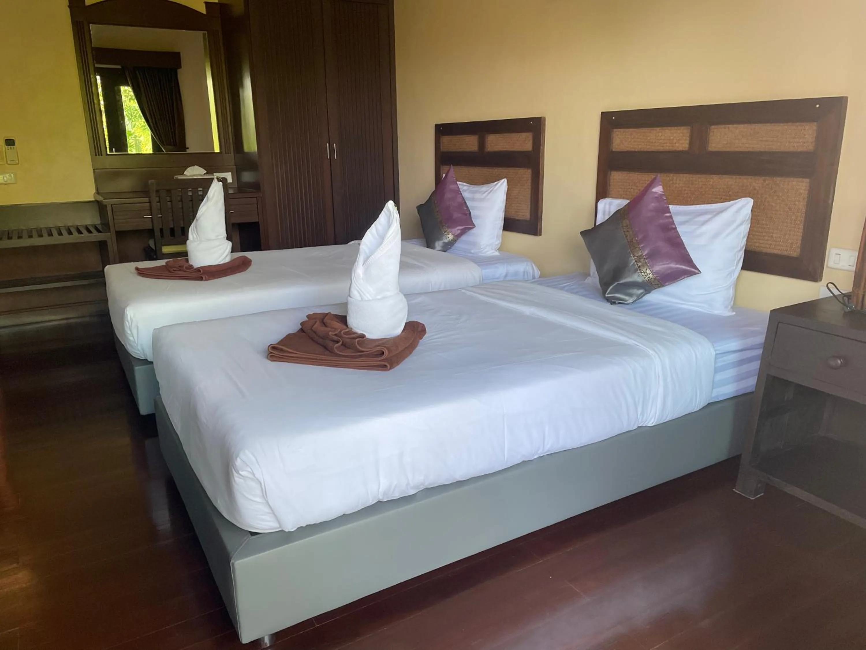 Bed in Grand Manita Beach Resort