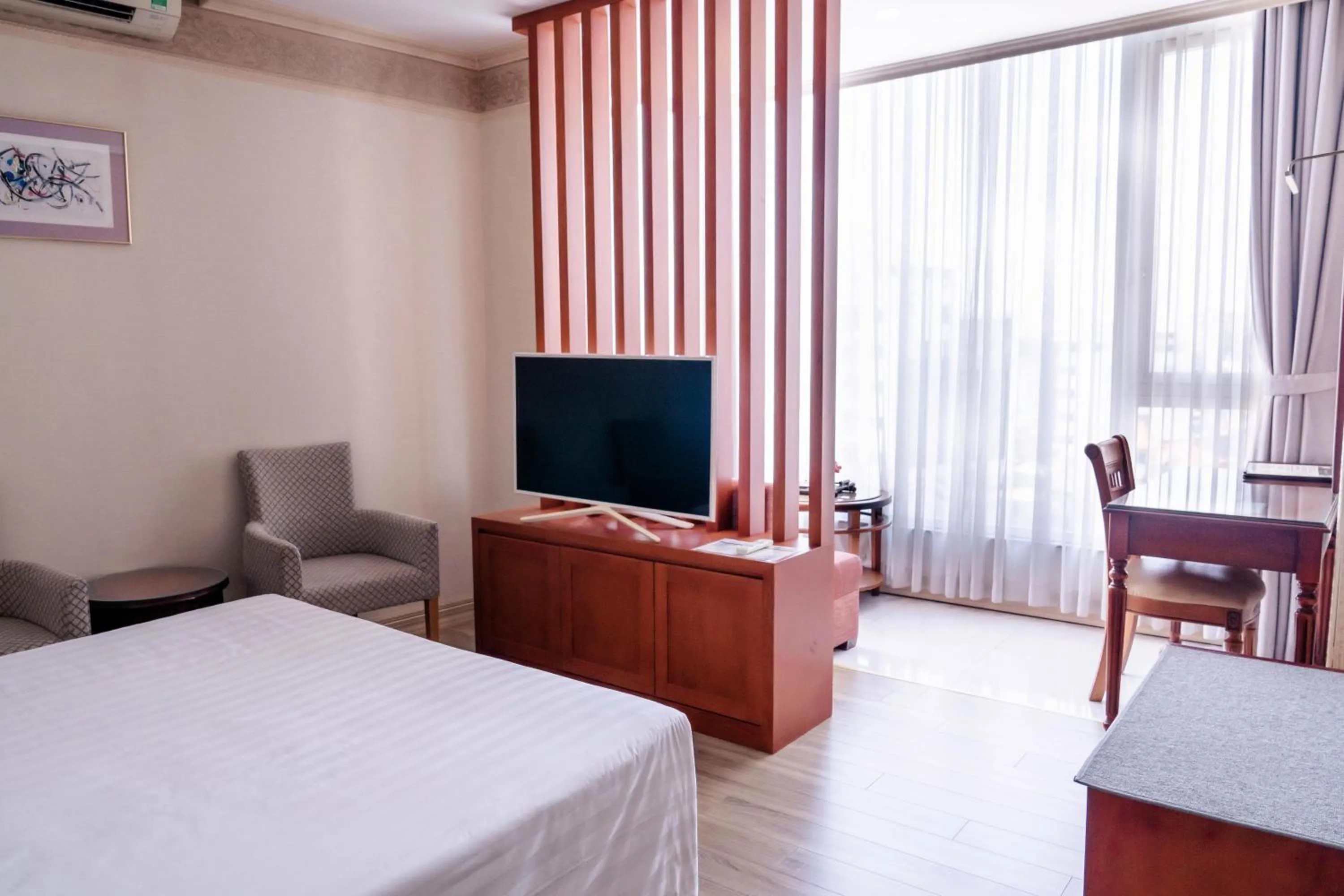 Bed in Lotus Saigon Hotel