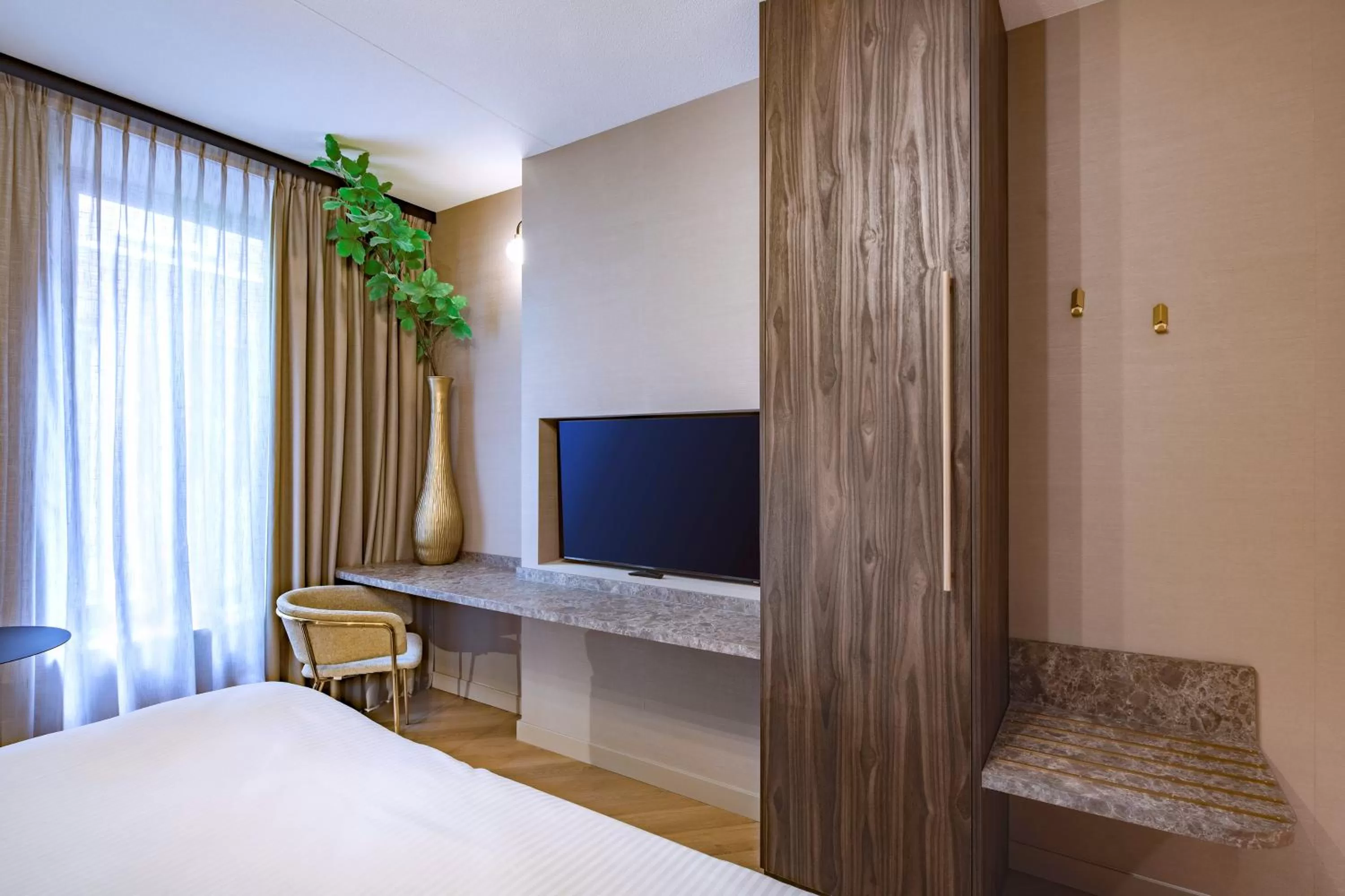 Bed in Breathe Boutique Hotel