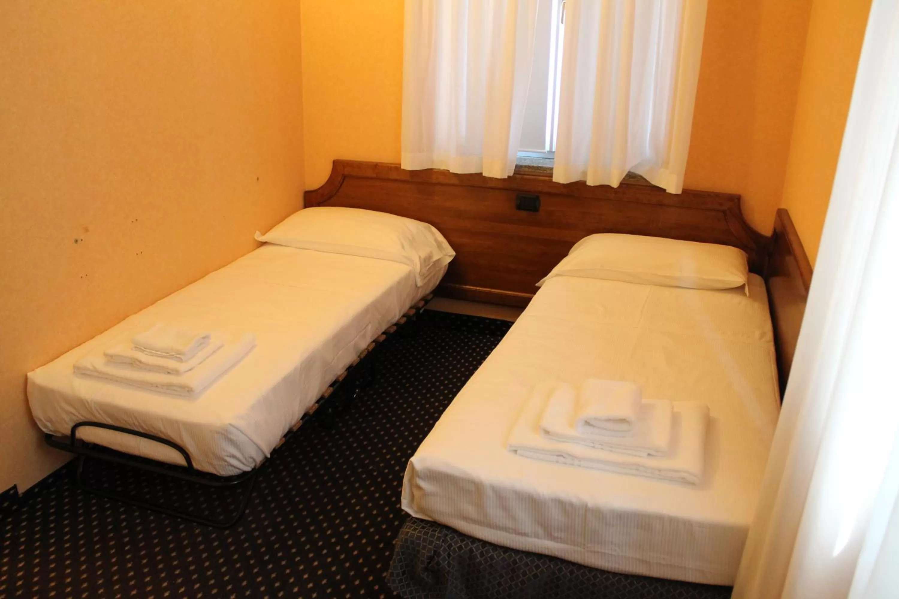 Bed in Hotel Don Carlo