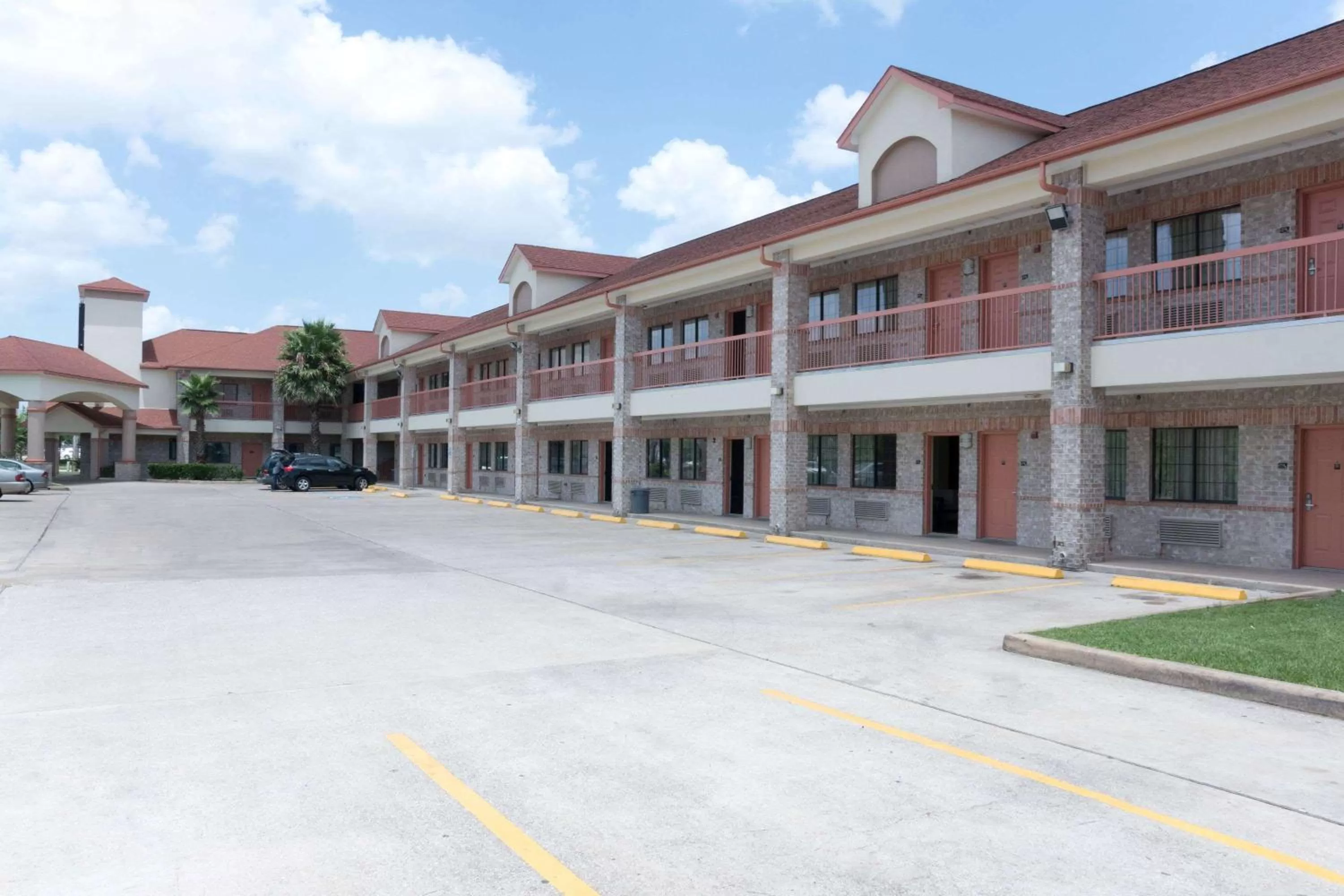 Property building in Super 8 by Wyndham Stafford Sugarland Area