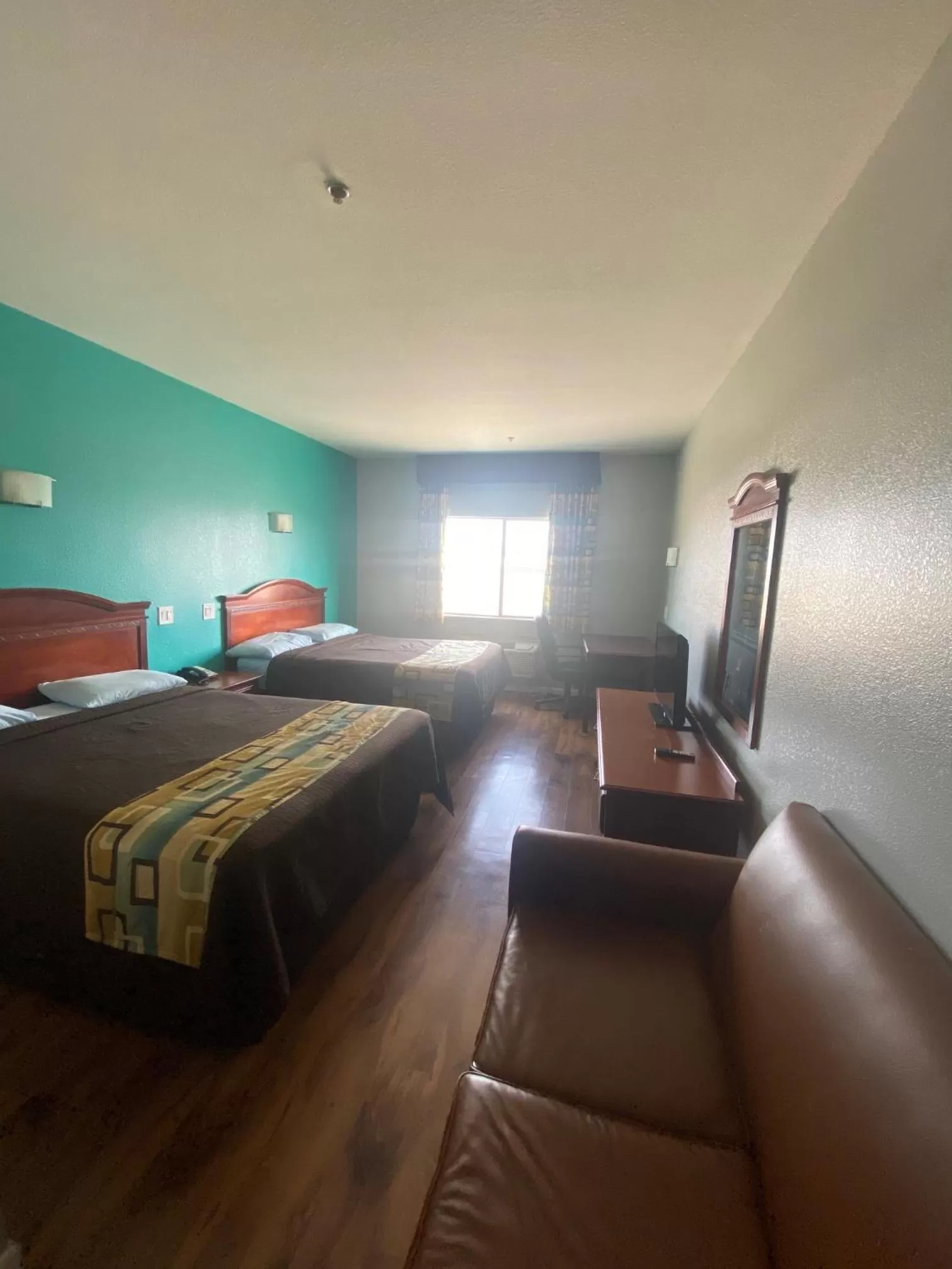 Bed in Tropicana Inn and Suites