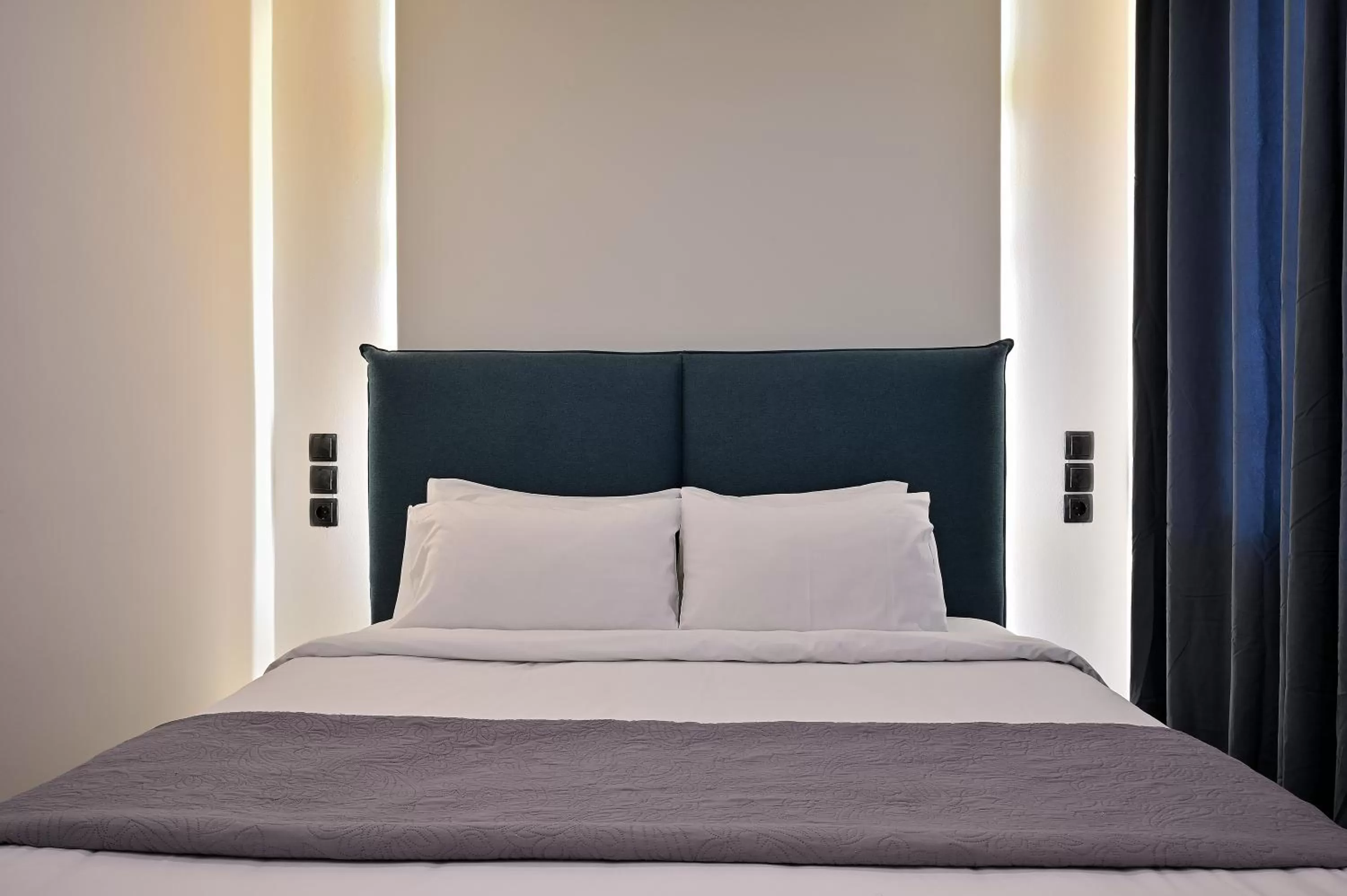 Bed in The Athens Version Luxury Suites