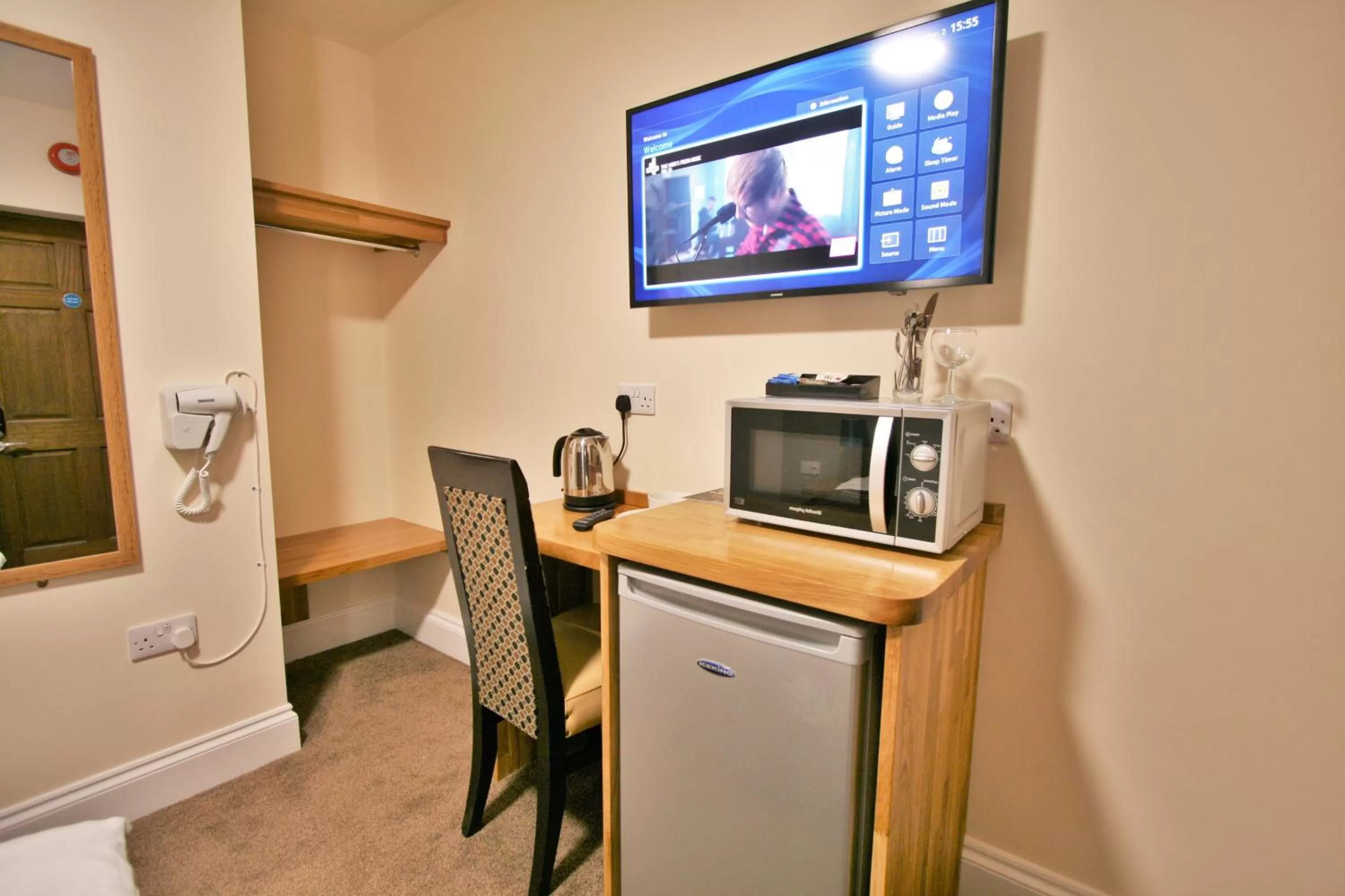 TV and multimedia in New County Hotel & Serviced Apartments by RoomsBooked