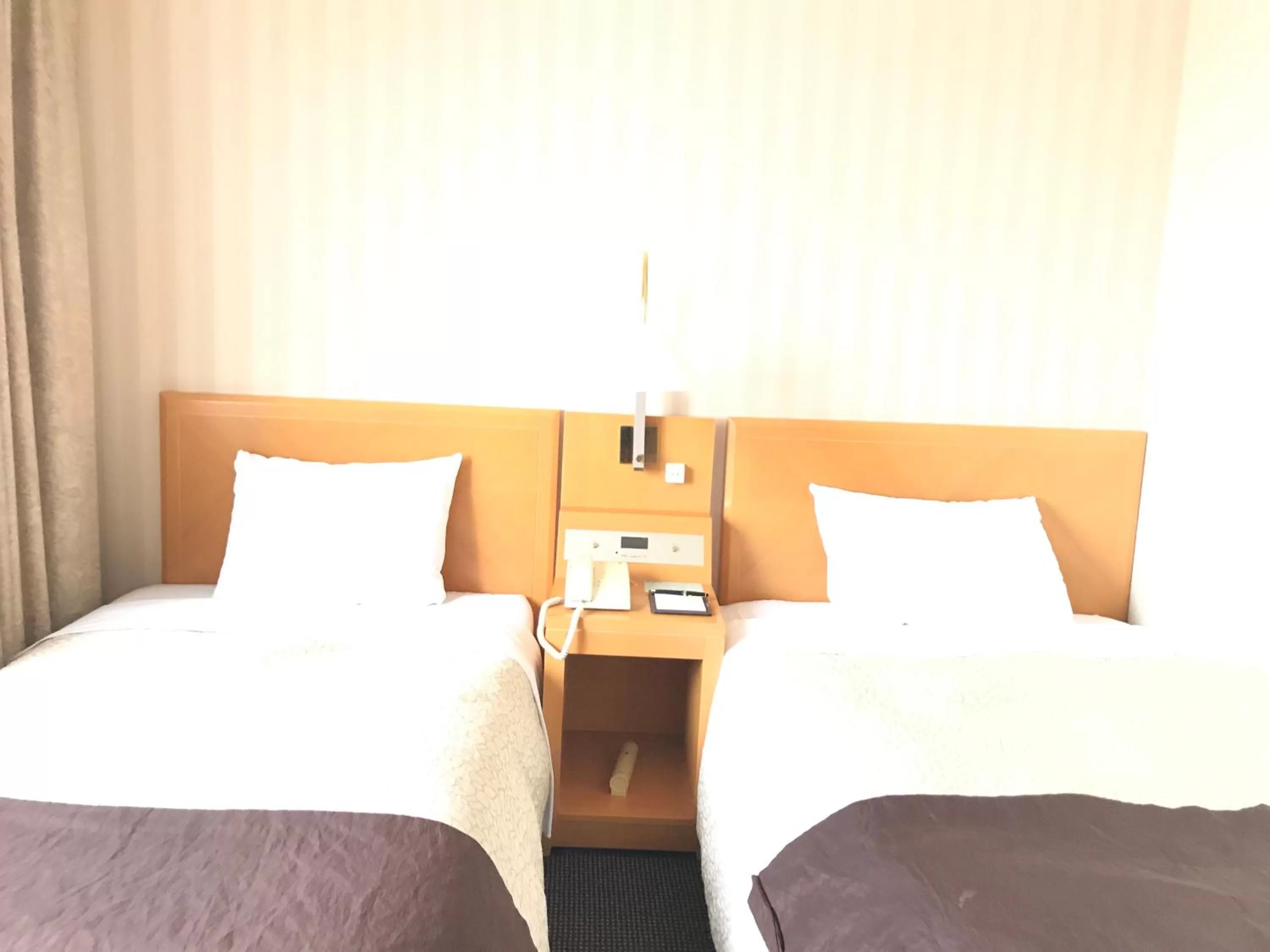 Bed in Numazu River Side Hotel