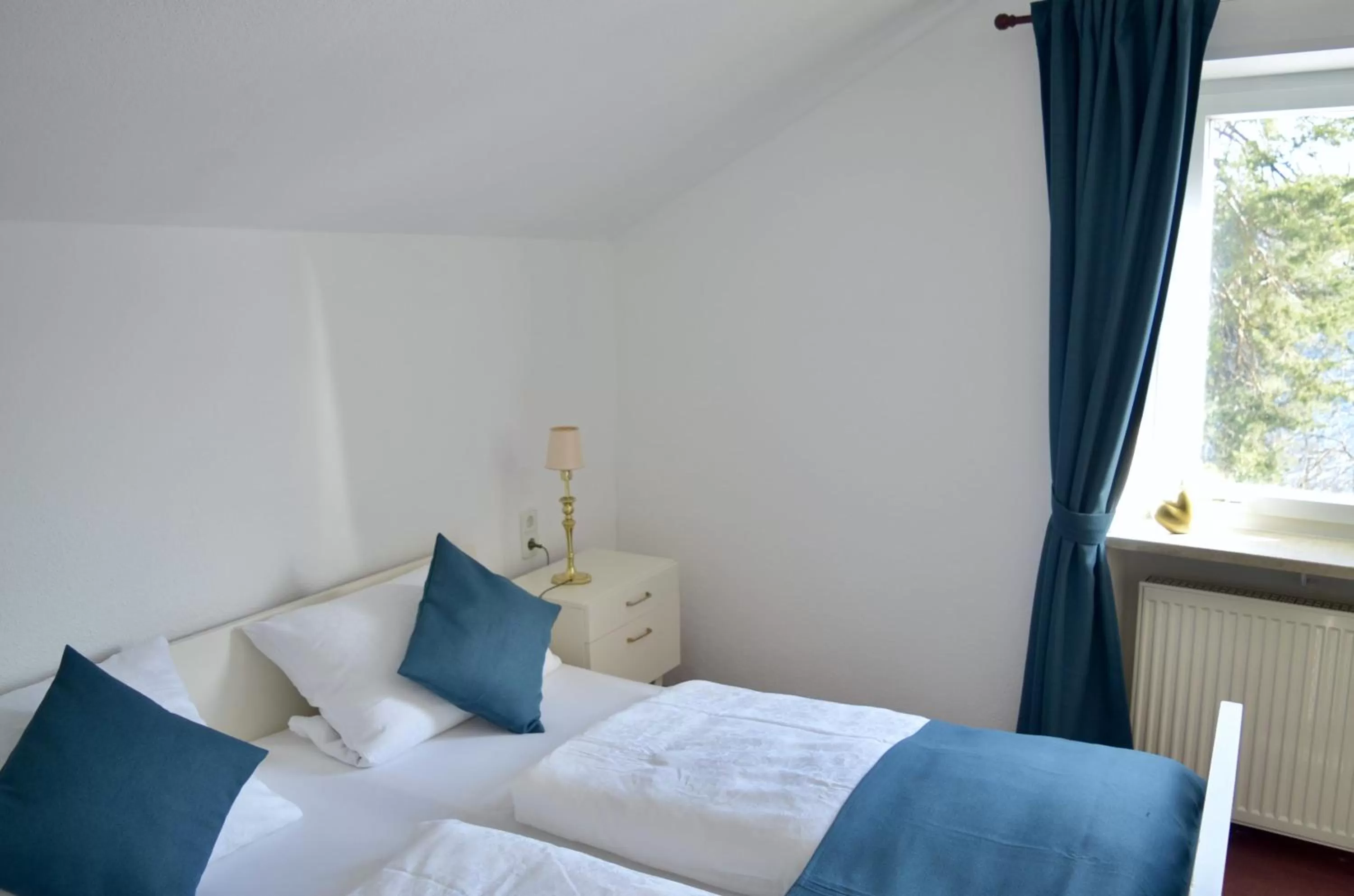 Bed in Pension und Ferienwohnung Frech