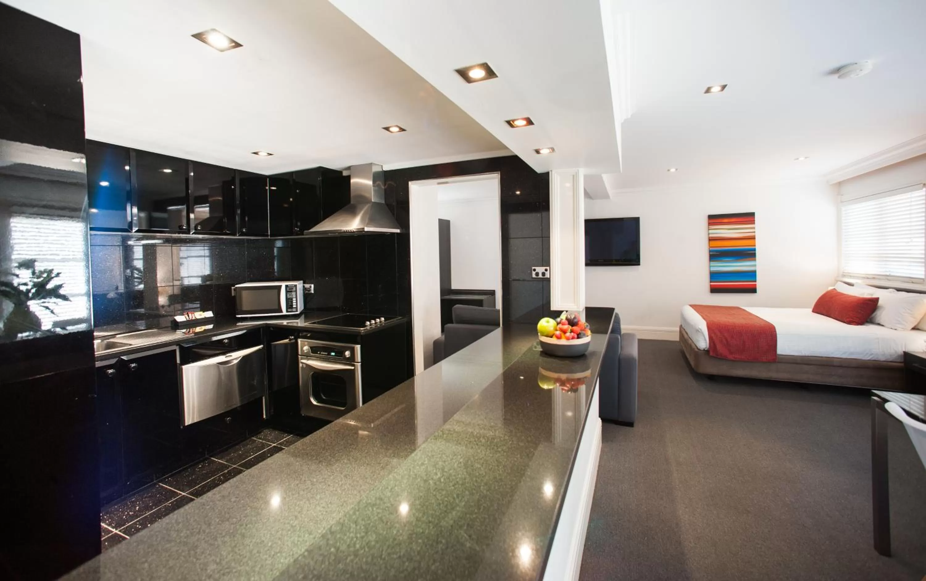 Kitchen or kitchenette in Ramada Hotel & Suites by Wyndham Cabramatta
