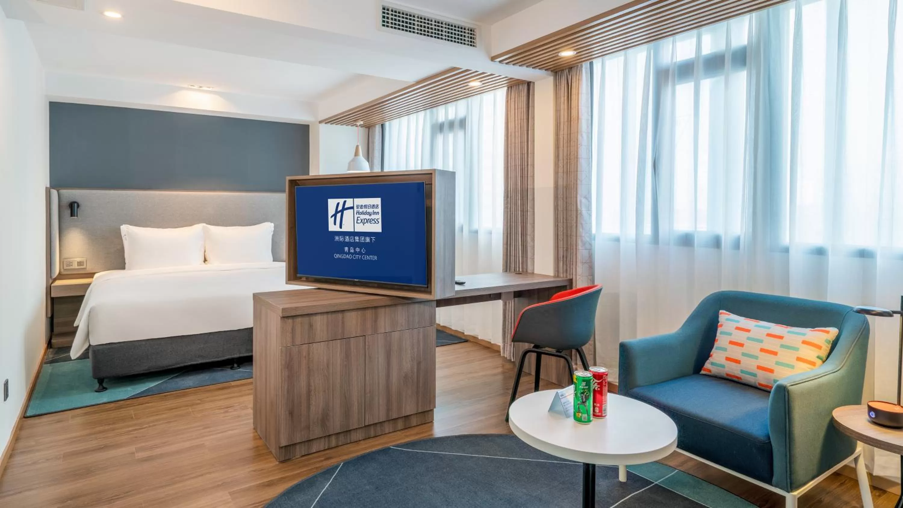 Living room, Bed in Holiday Inn Express Qingdao City Center by IHG