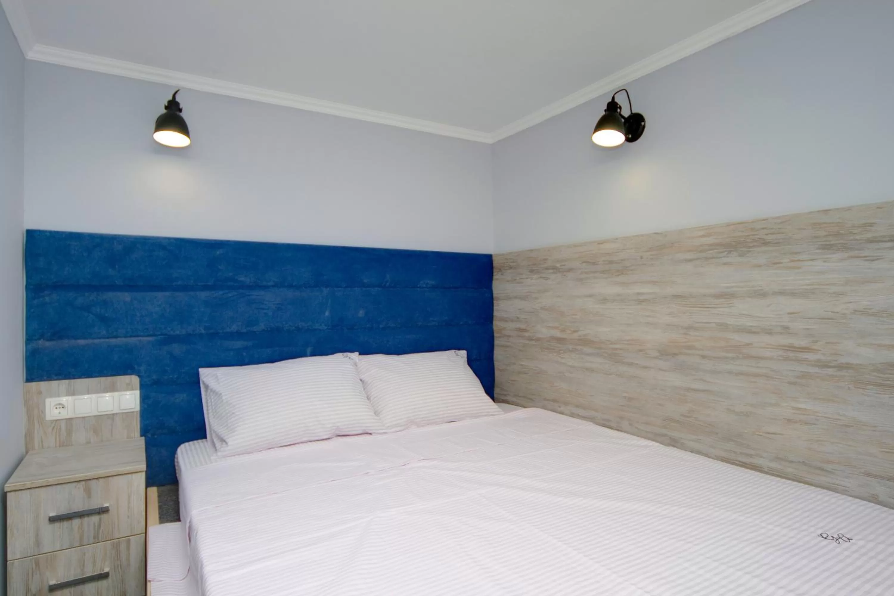 Bed in Grand Apartments