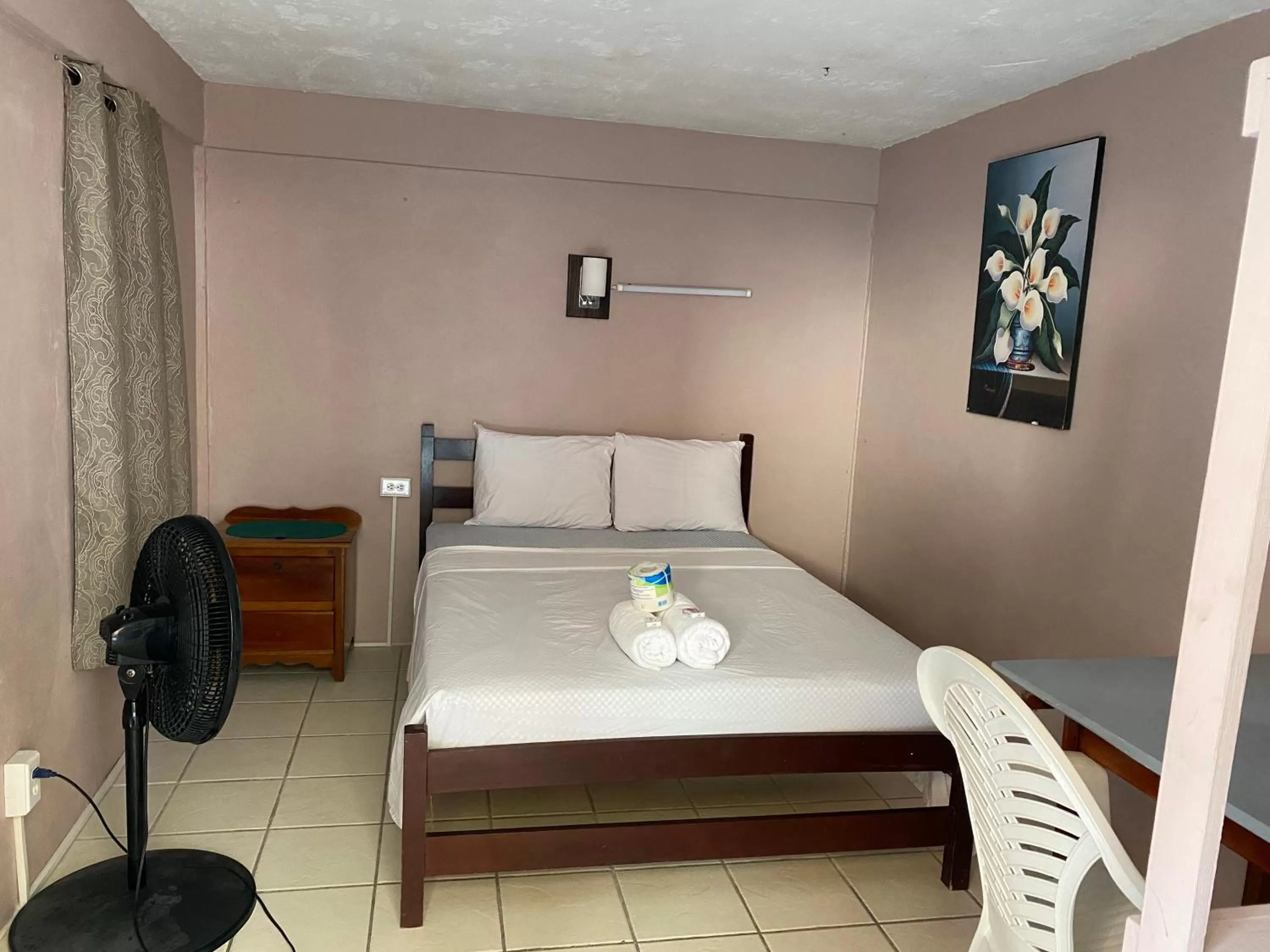 Bed in Blue Wave Guest House