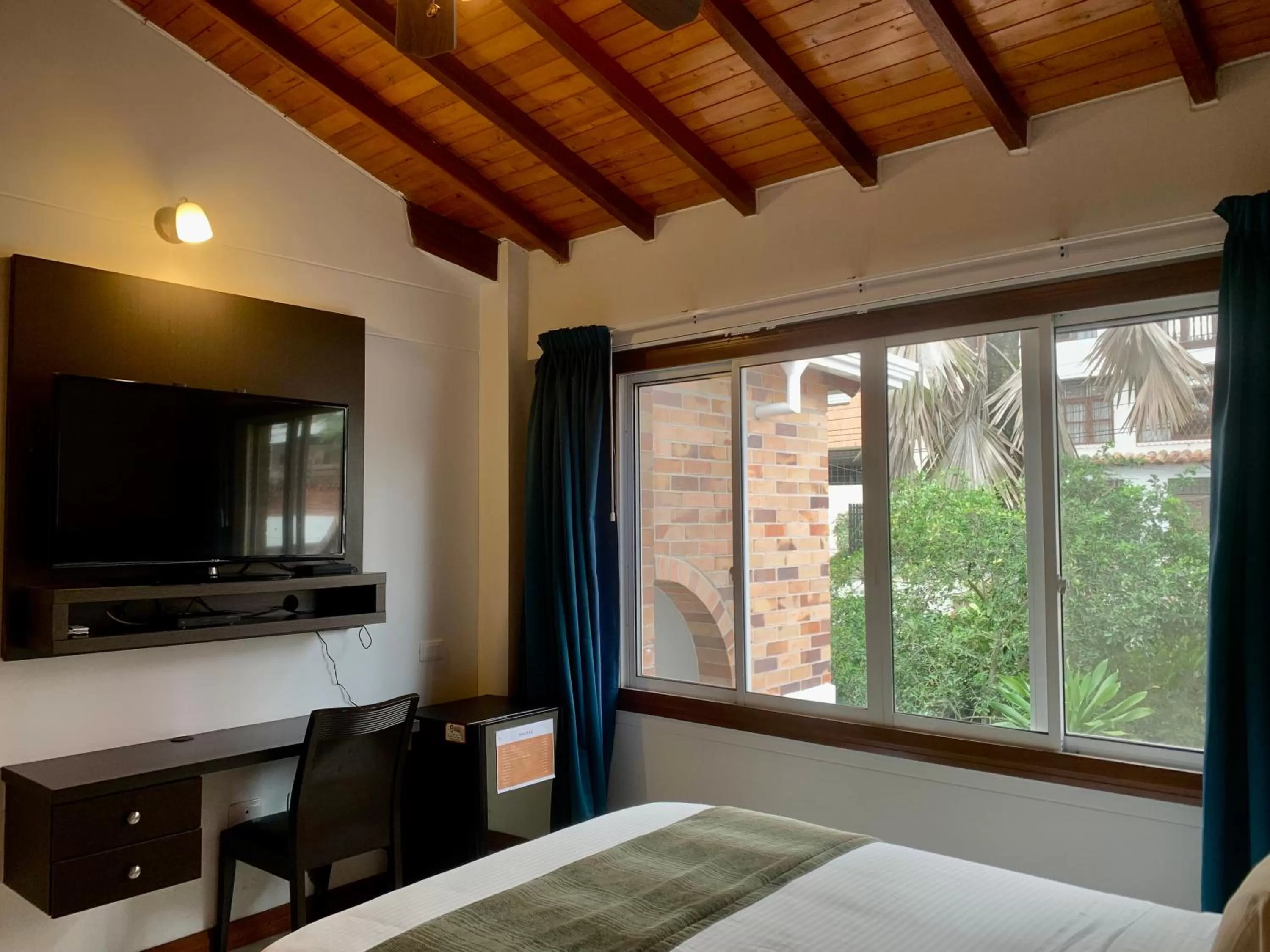 Bedroom, TV/Entertainment Center in Hotel Serenity Suites Casa Boutique
