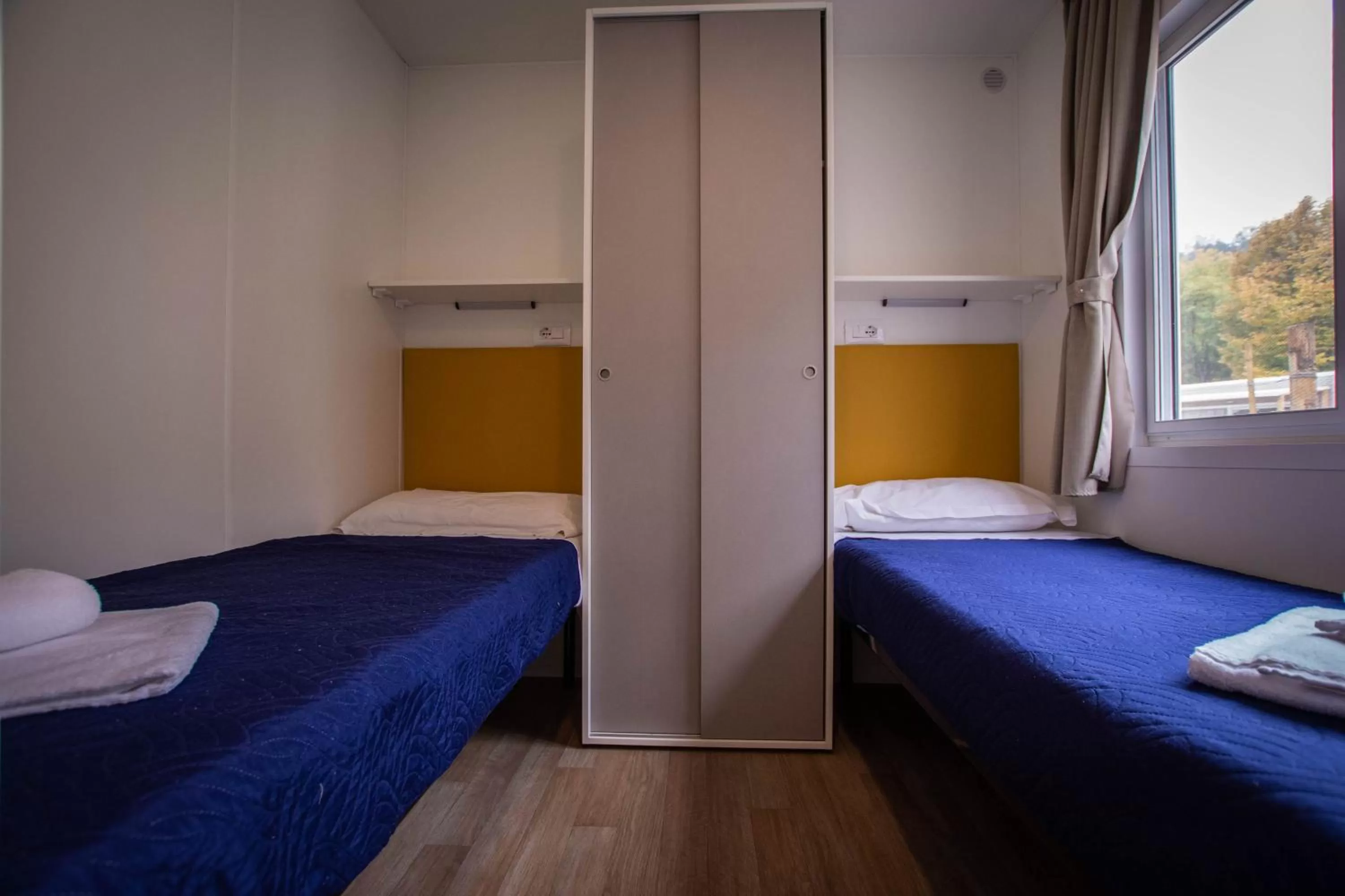 Bed in Albavillage Rooms & Camping