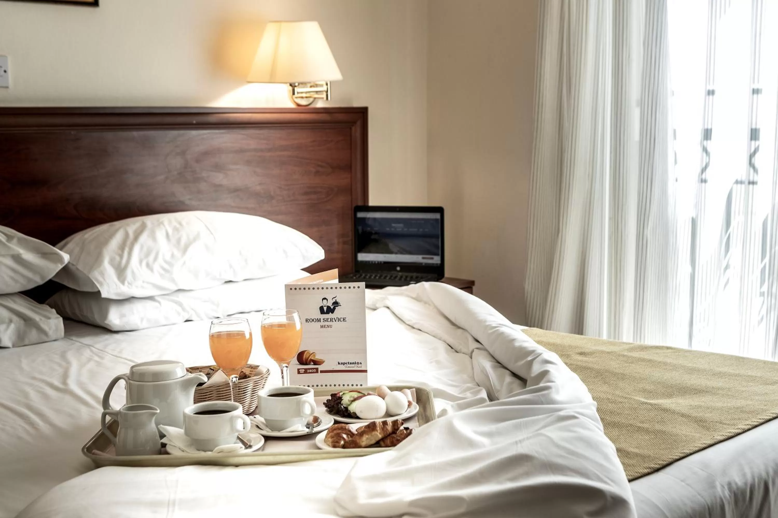 Bed in Kapetanios Limassol Hotel