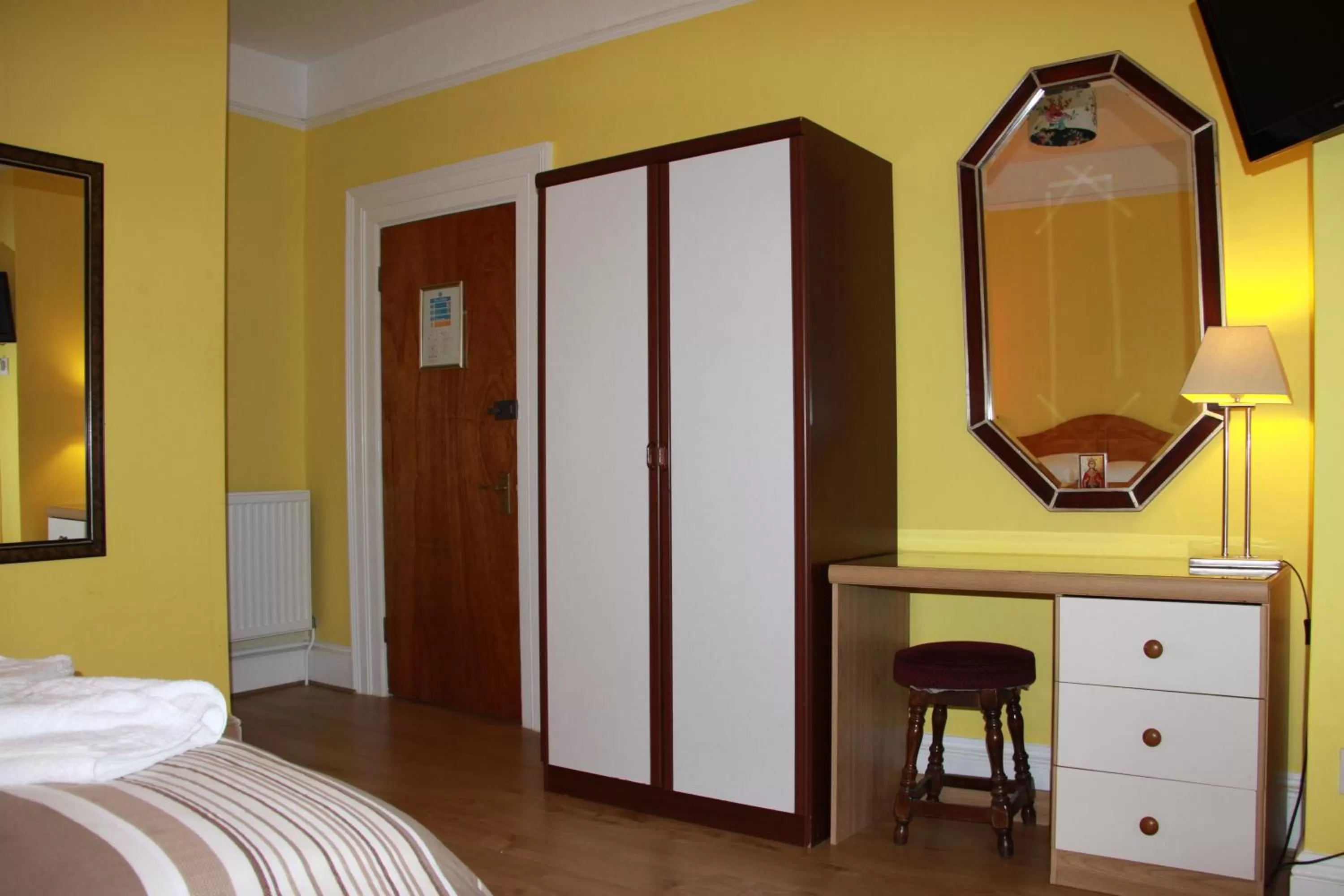 Bed in Ambassador Hotel