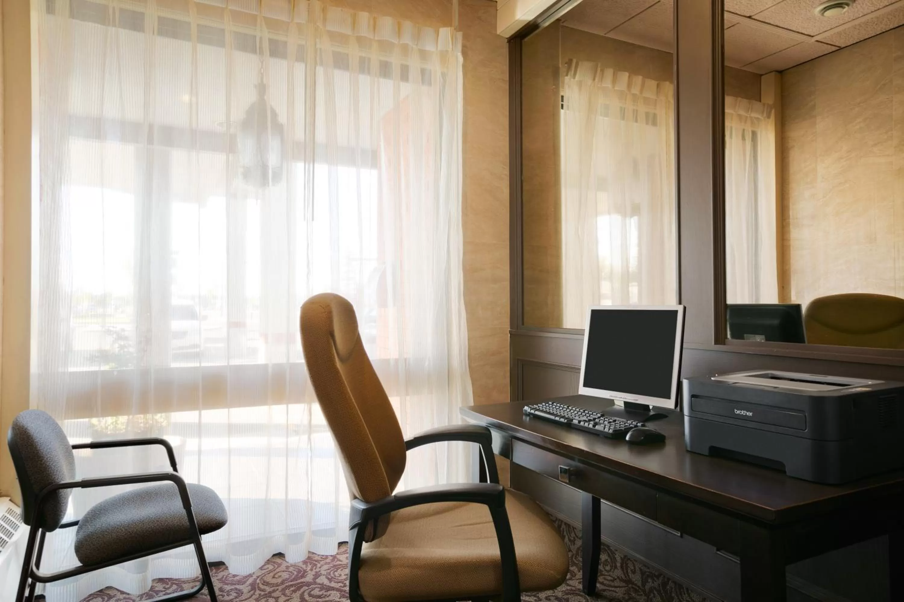 Seating area in Ramada by Wyndham Lethbridge
