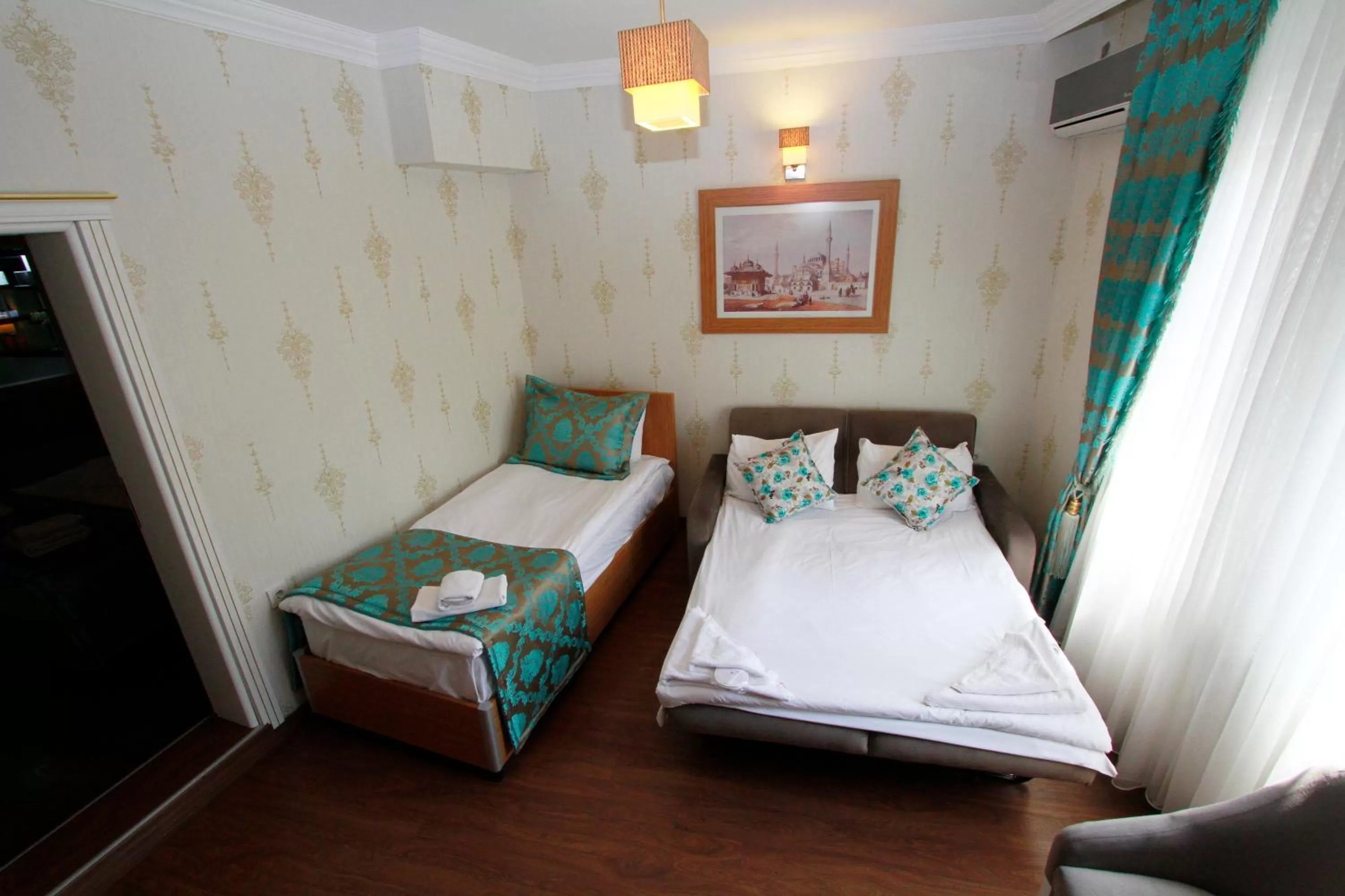 Bed in Agora Boutique Hotel & Bistro