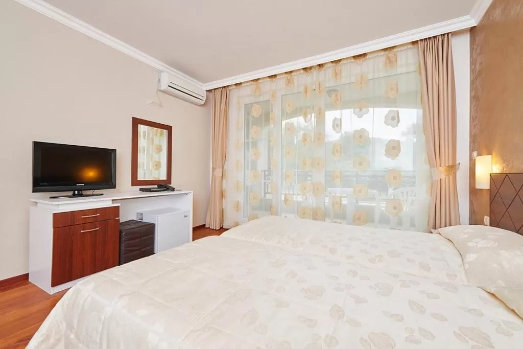 Bed in Penelopa Palace Apart Hotel & SPA