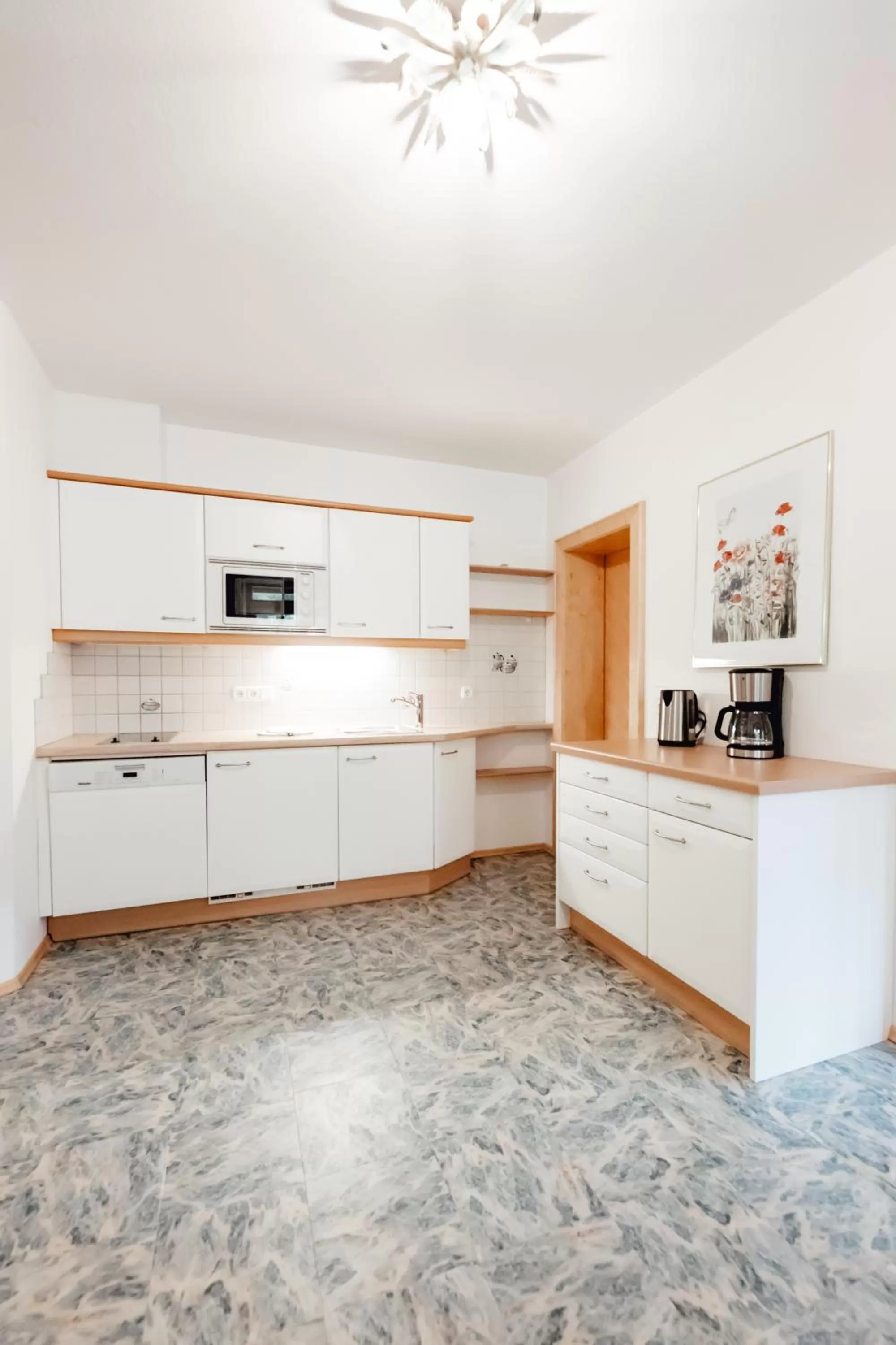 Kitchen or kitchenette in Dandler - Zimmer und Ferienwohnungen