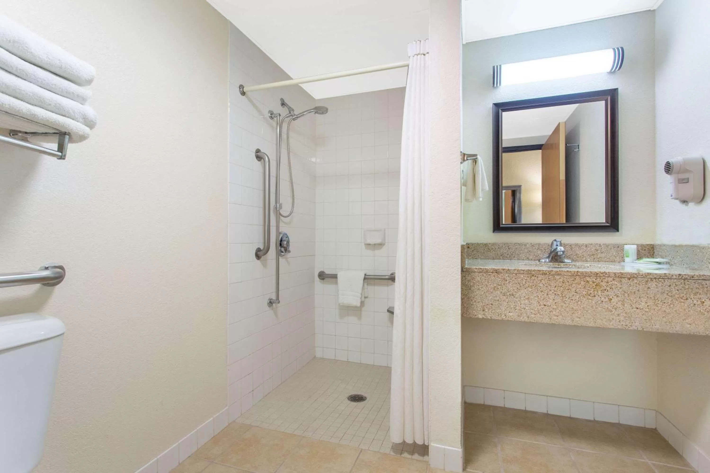 Shower in AmericInn by Wyndham West Bend