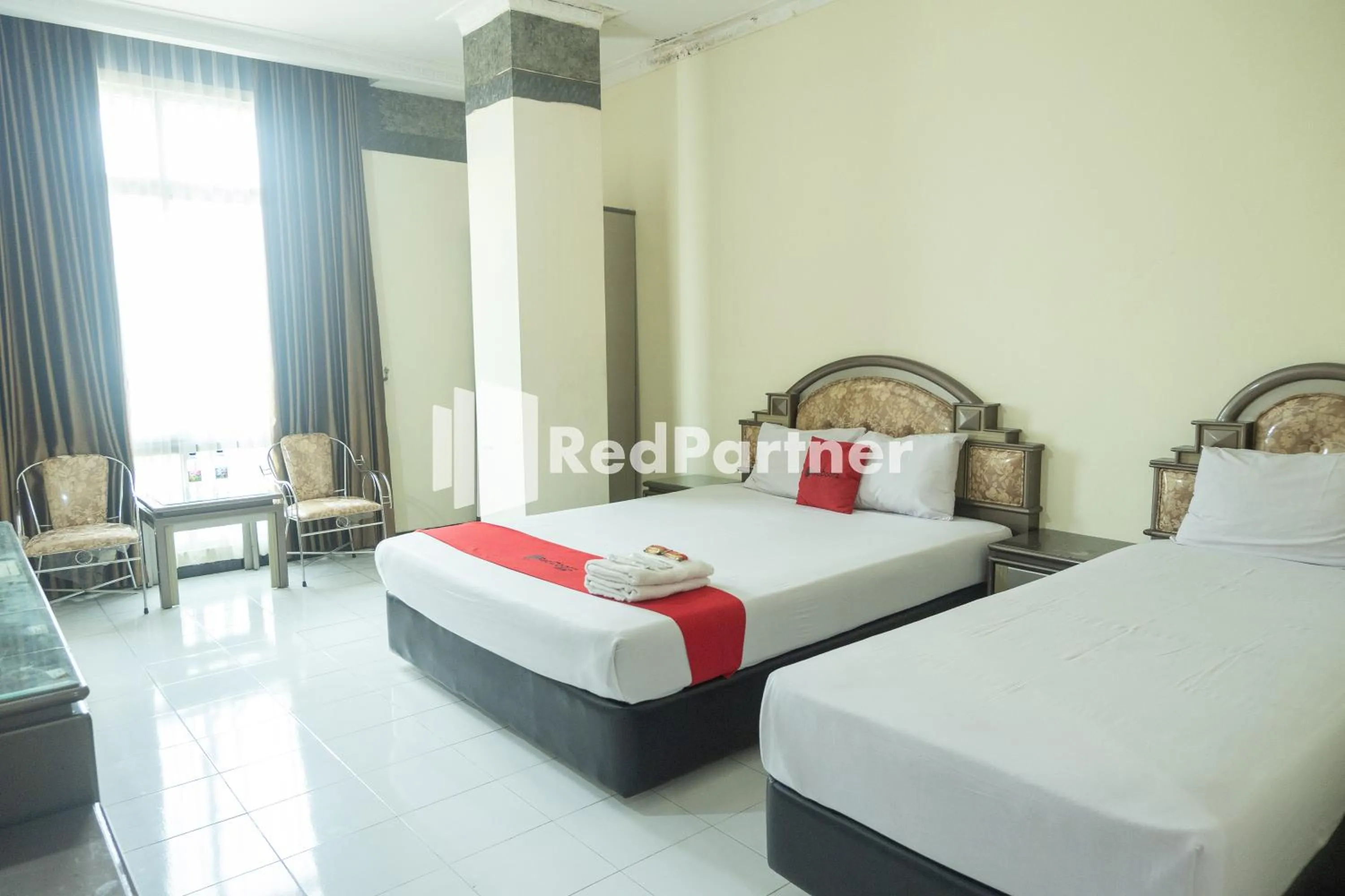 Bed in Akur Hotel Malioboro Mitra RedDoorz